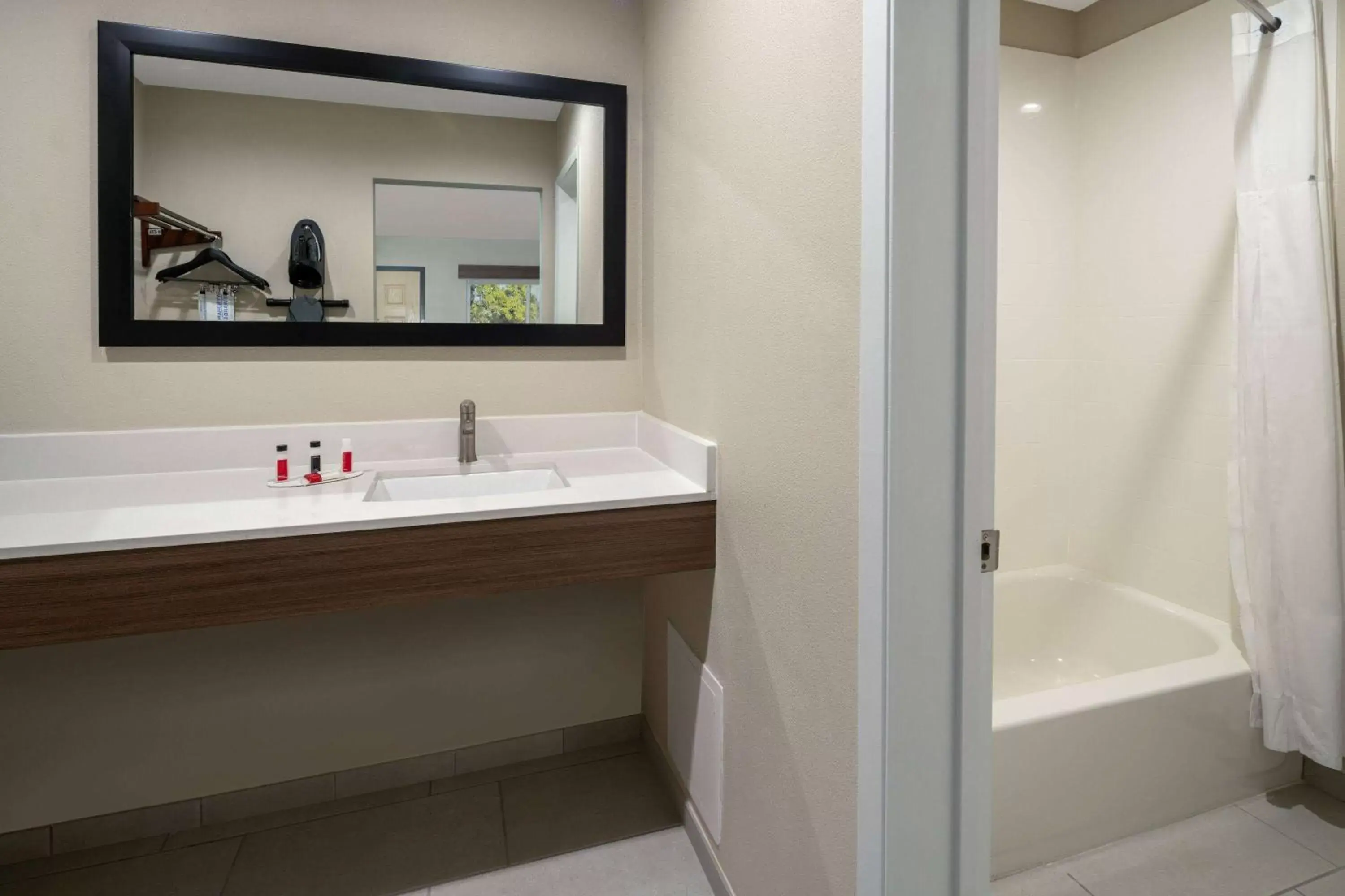 Bathroom in Ramada by Wyndham Modesto Yosemite Area