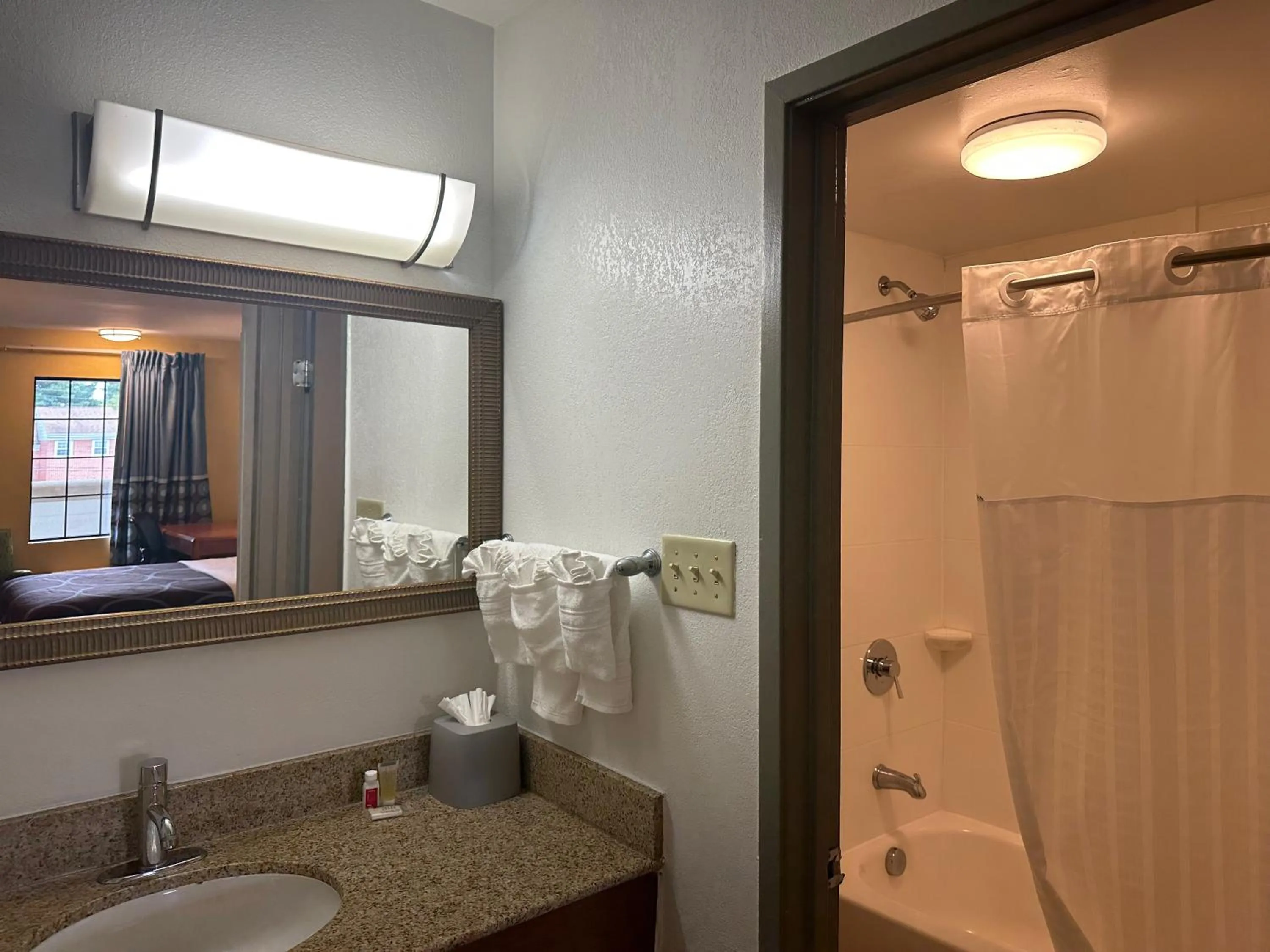 Bathroom in Super 8 by Wyndham WestEnd Alexandria,VA Washington DC Area