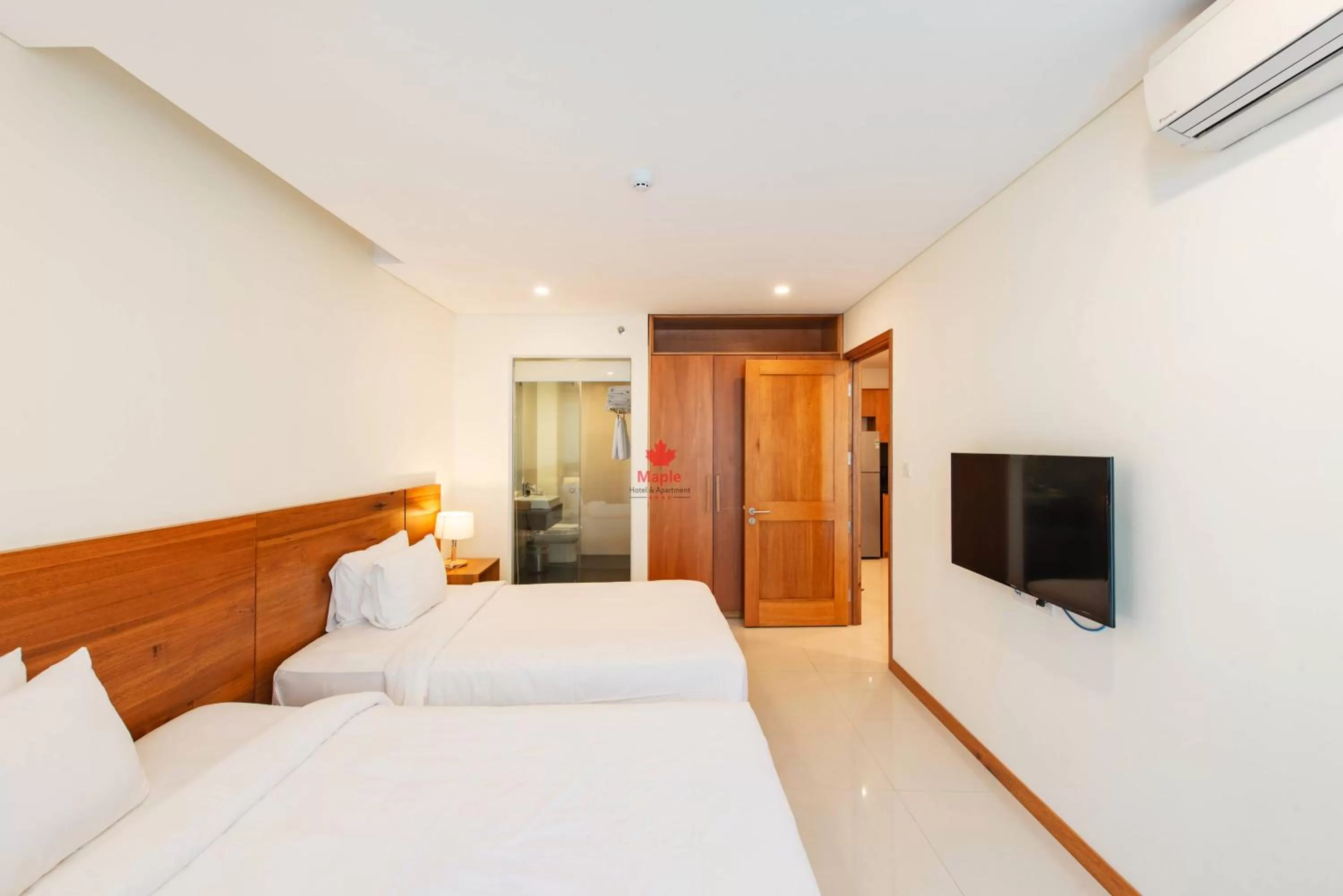 Bed in Maple Hotel & Apartment