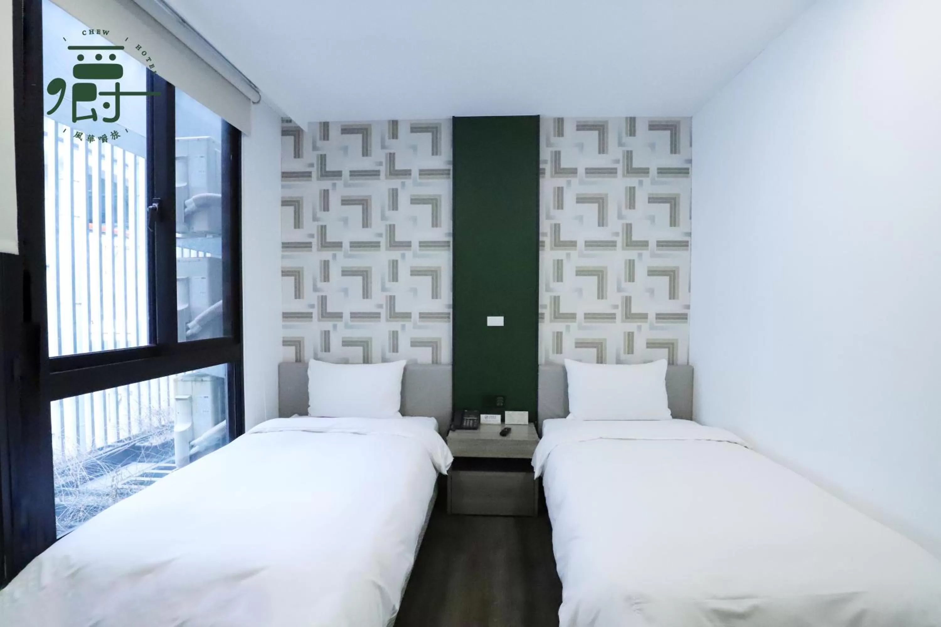 Bed in Aroma Chew Hotel