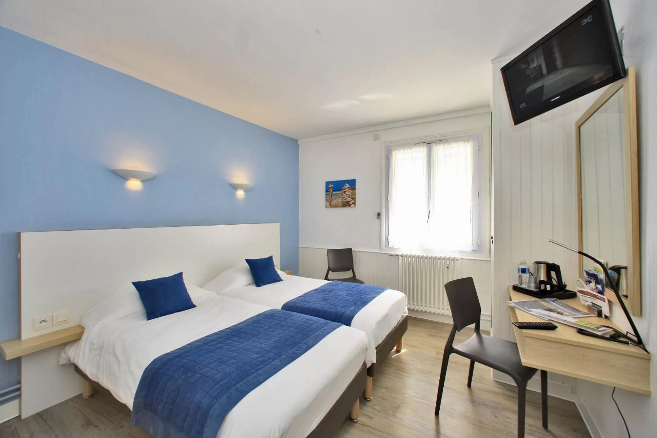 Bed in Hotel Les Dunes