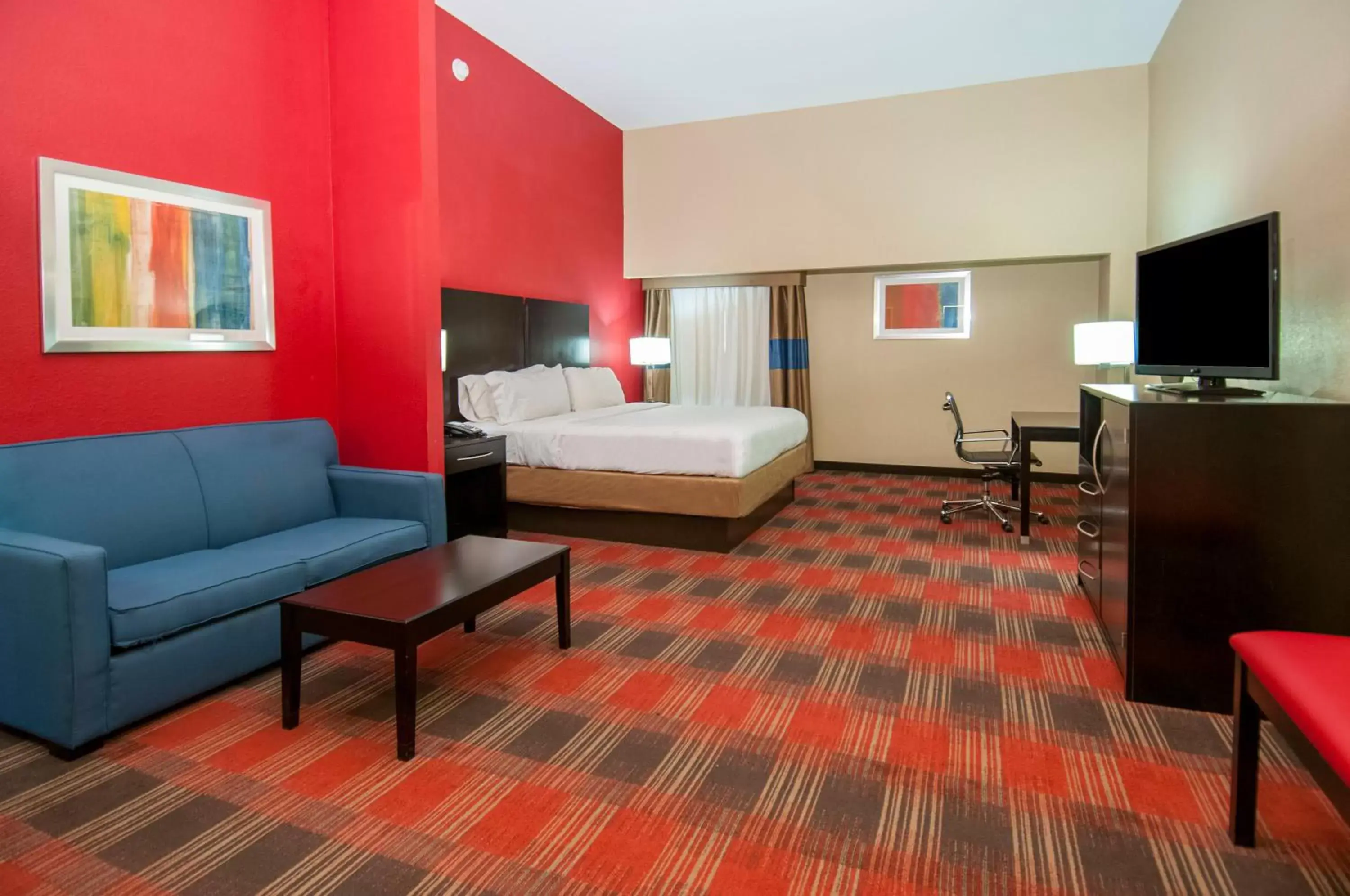 Bedroom in Holiday Inn Express & Suites Jackson Downtown - Coliseum, an IHG Hotel