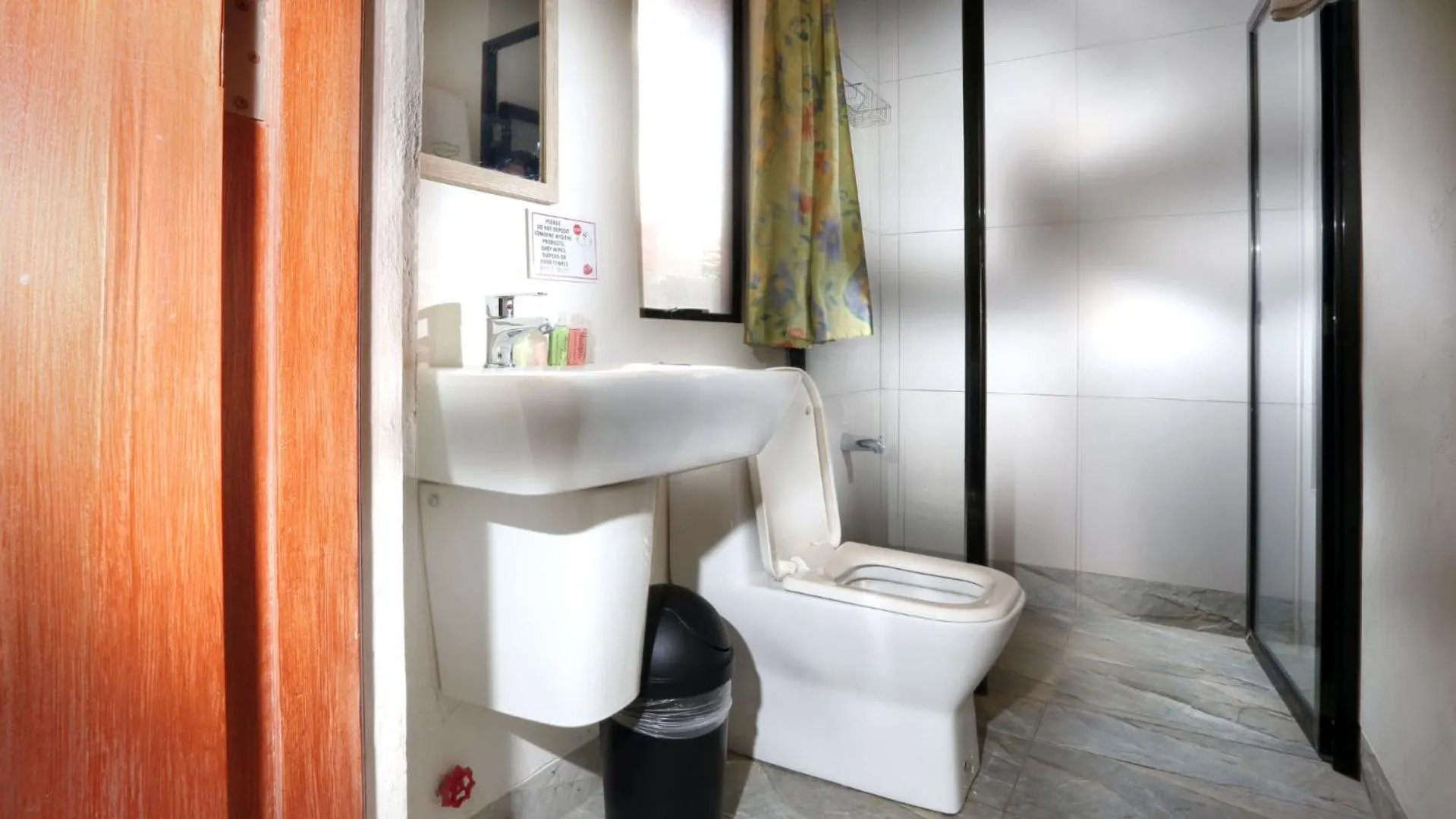 Toilet in 1775 Adriatico Suites