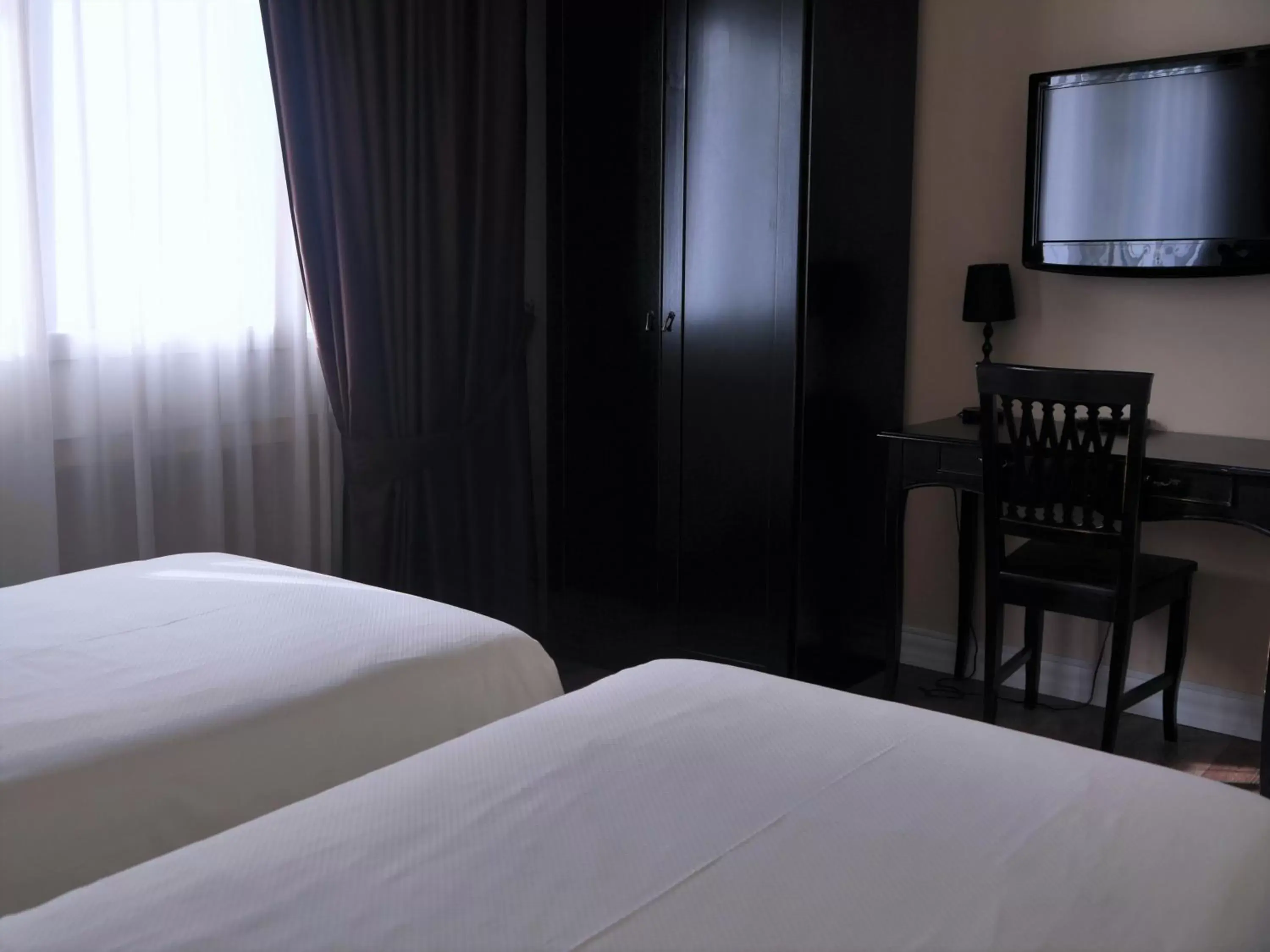Bed, TV/Entertainment Center in Hotel Patavium