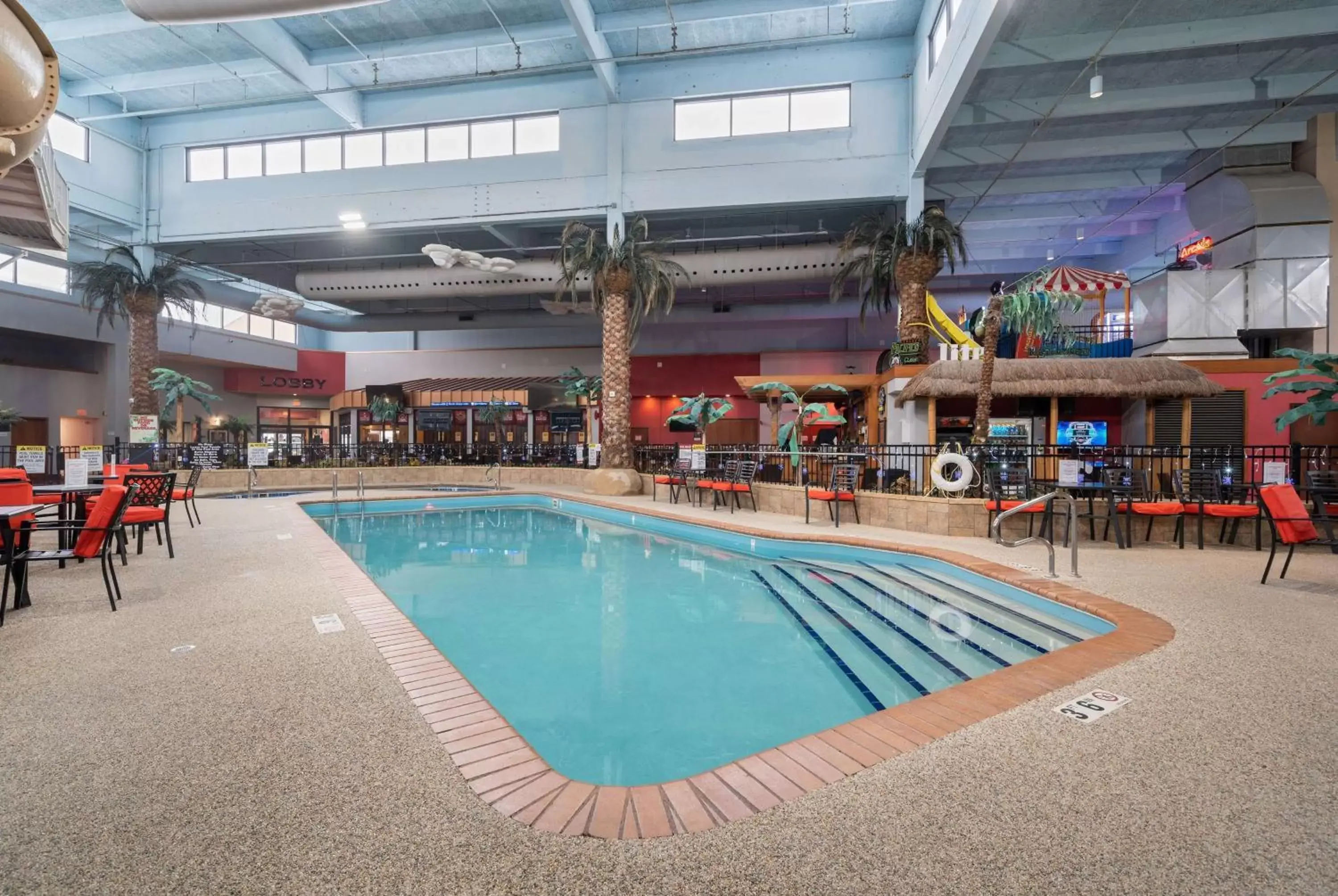 Swimming Pool in Ramada by Wyndham Sioux Falls Airport - Waterpark Resort & Event Center