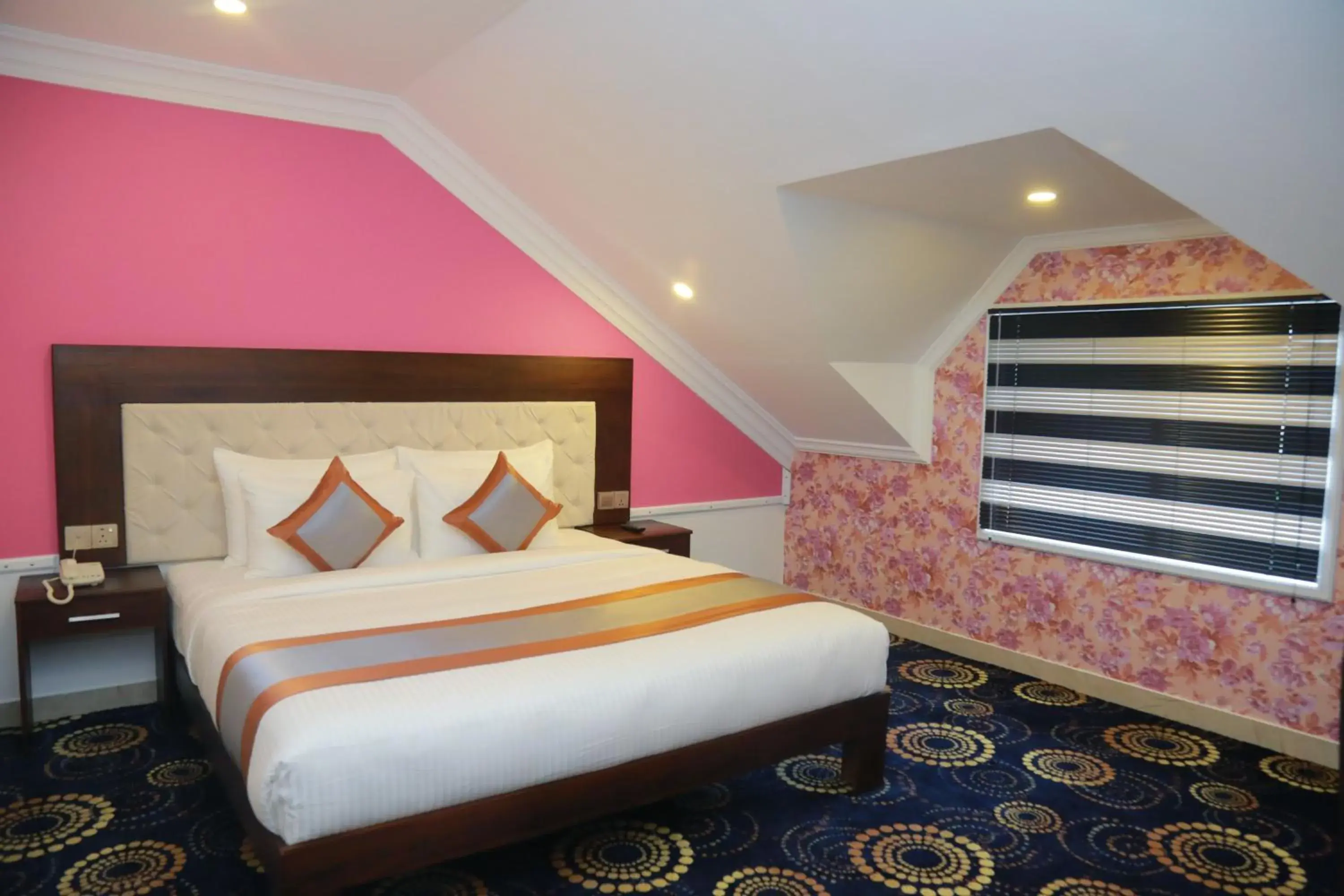 Bed in Galaxy Grand Hotel
