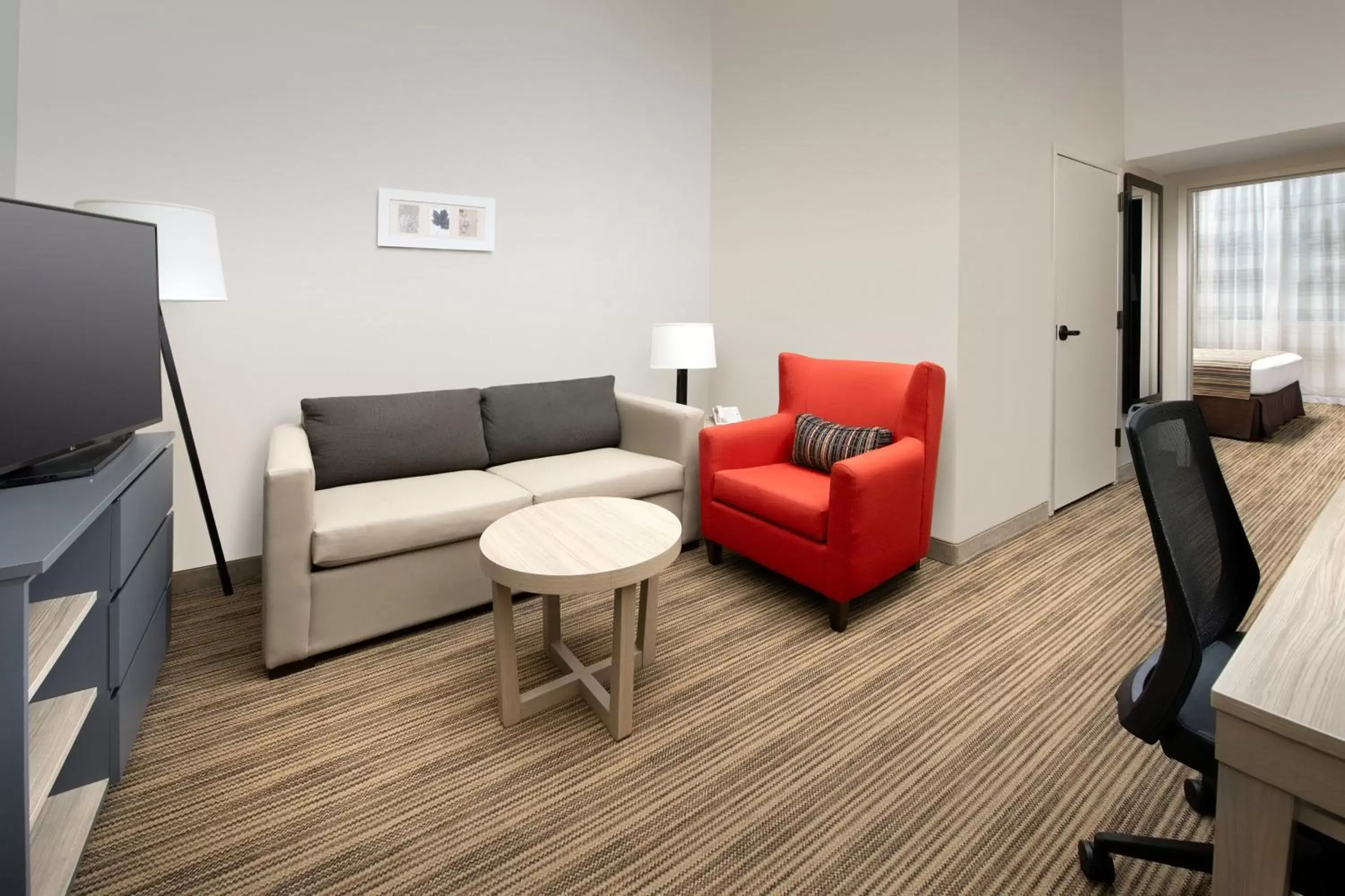 Living room, Seating Area in Country Inn & Suites by Radisson, Houston Intercontinental Airport East, TX