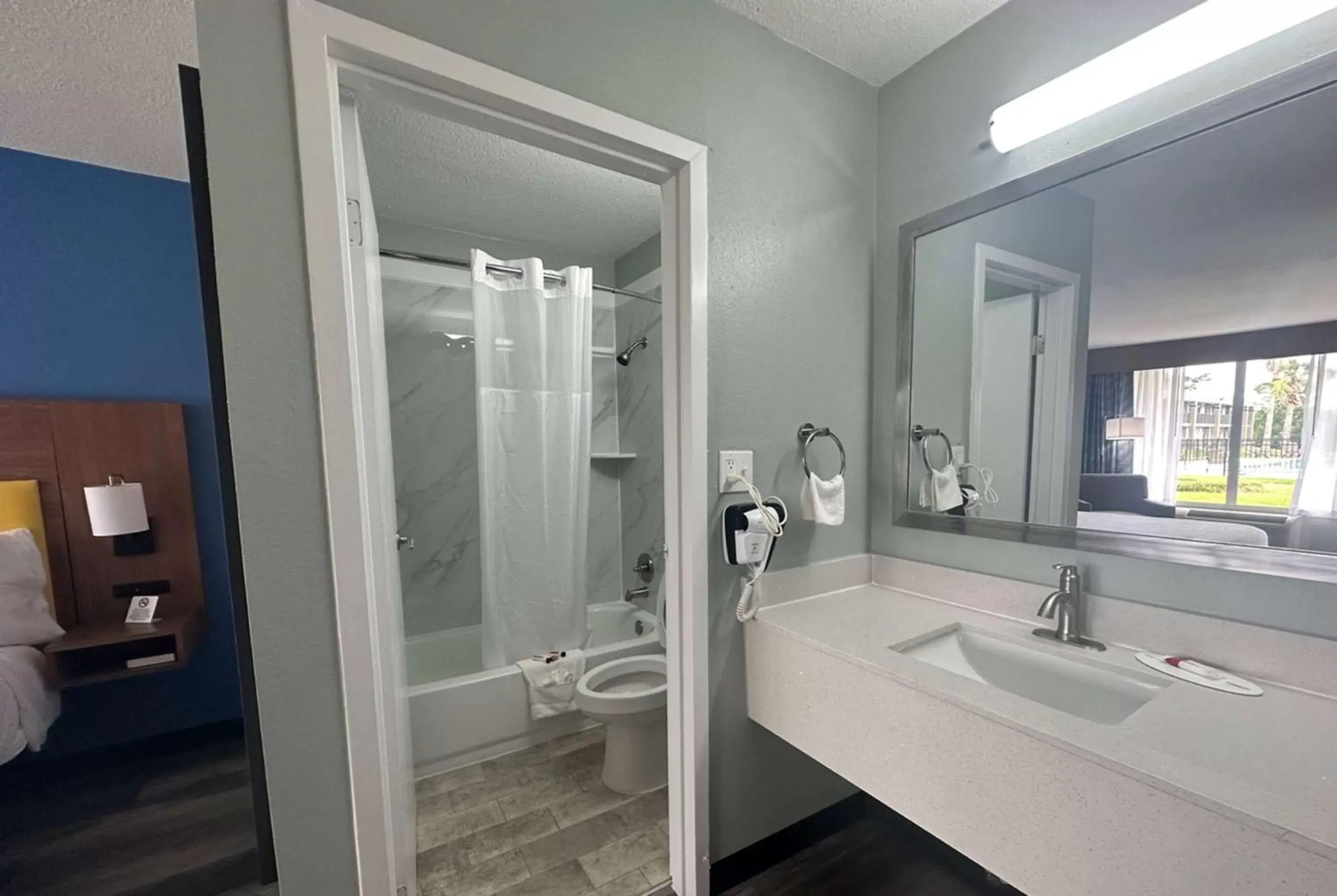 TV and multimedia, Bathroom in Days Inn & Suites by Wyndham Jennings