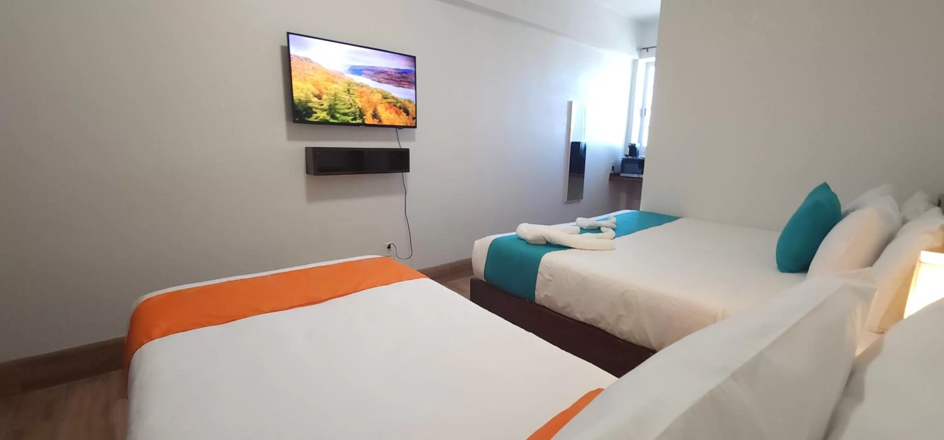 Bed in Voyager Sun & Reef Hotel