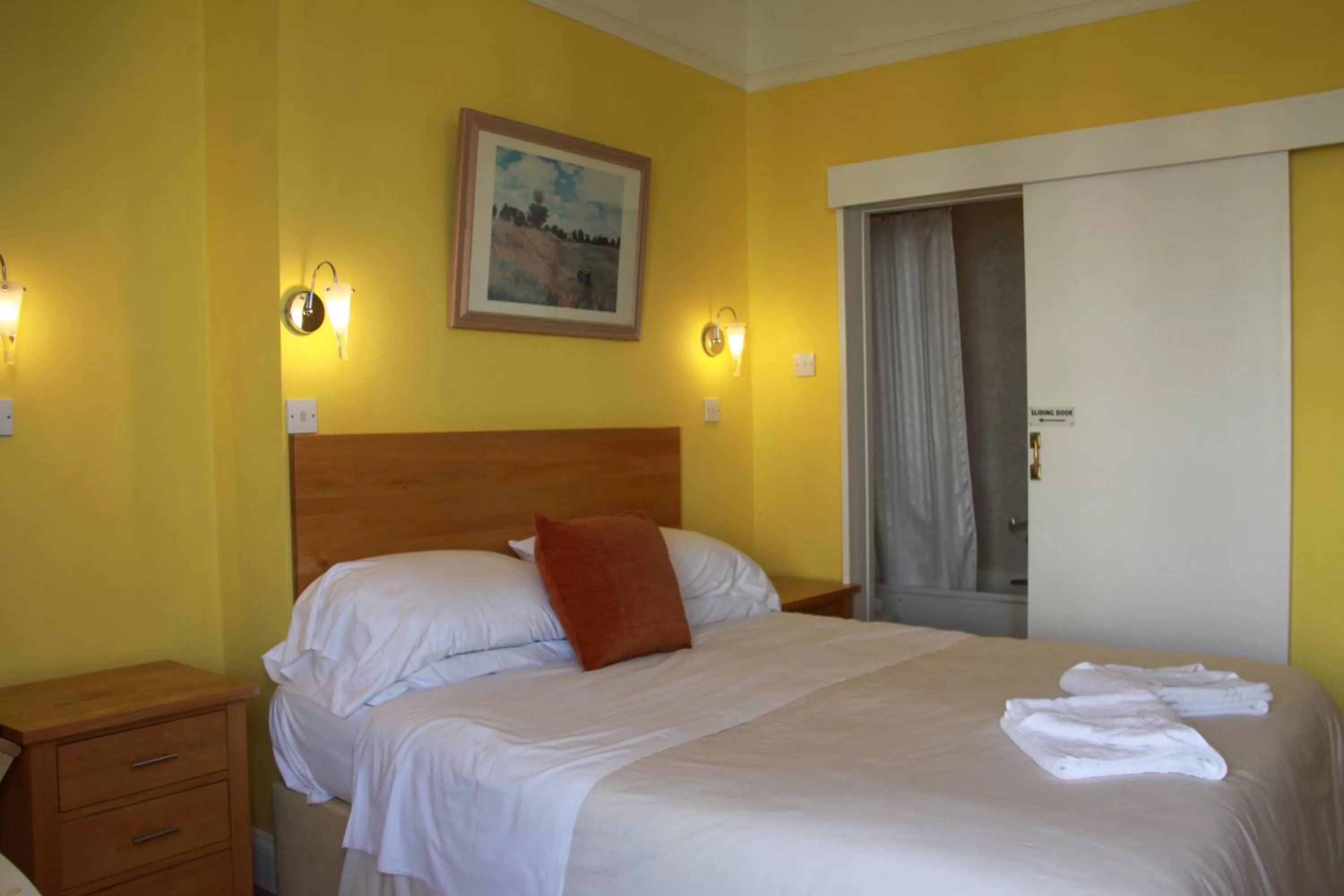 Bed in Ambassador Hotel