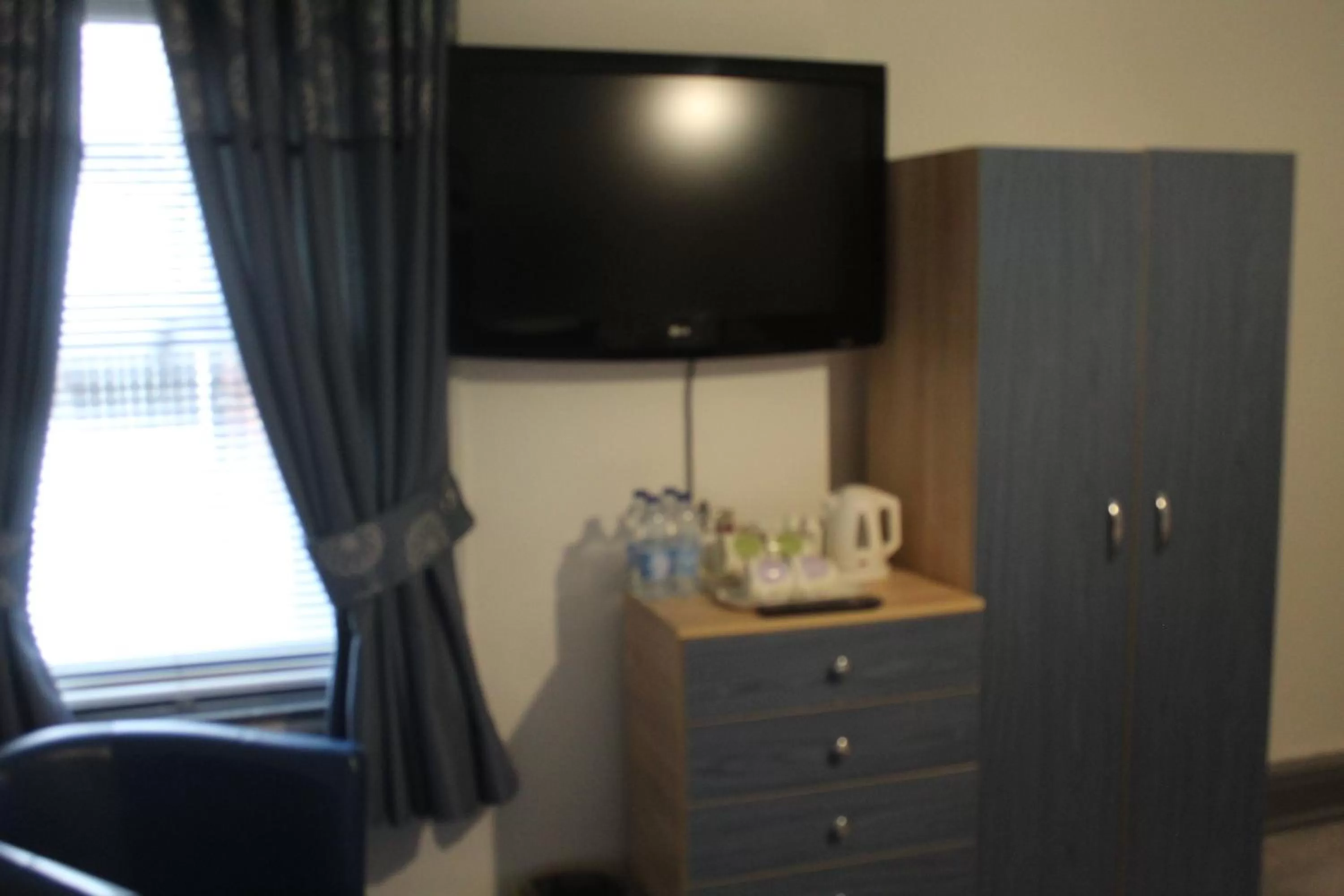 TV/Entertainment Center in Kings Boutique Hotel