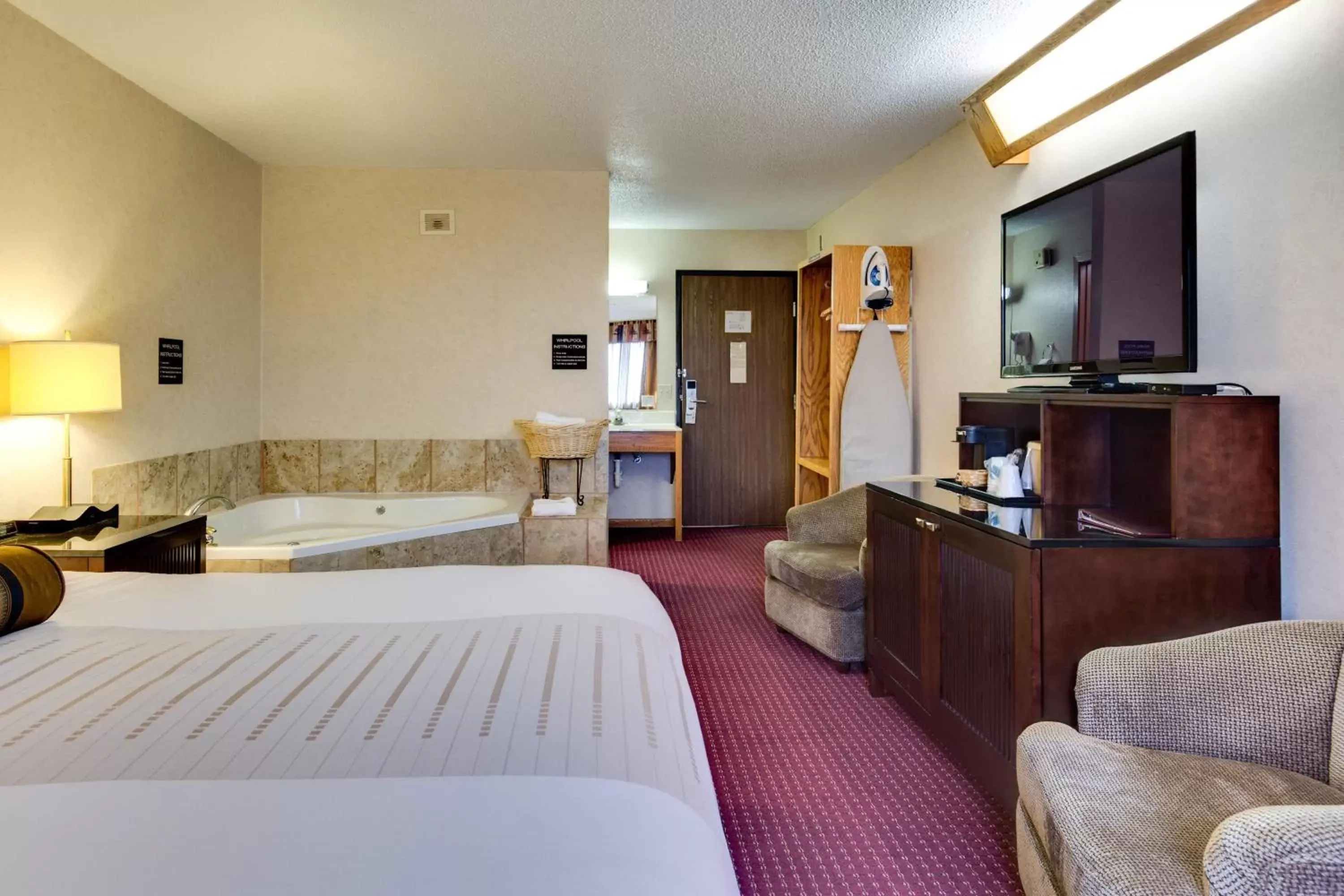 Photo of the whole room, TV/Entertainment Center in Fireside Inn and Suites