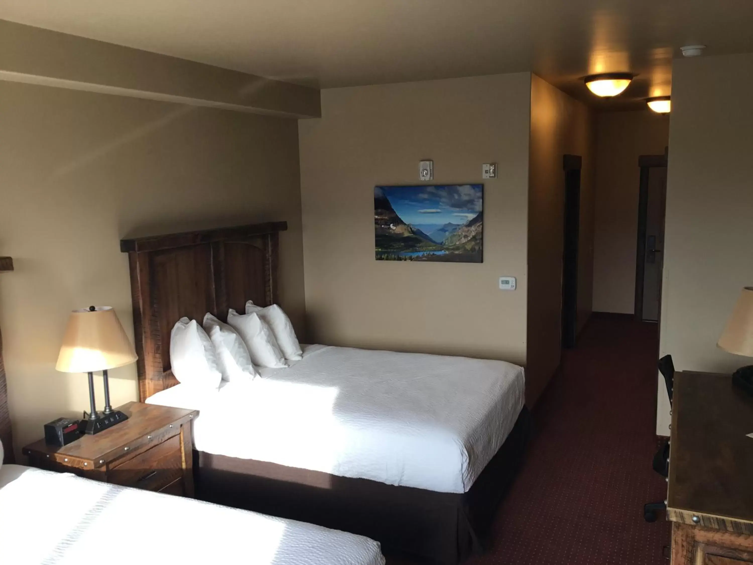 Bed in Glacier International Lodge