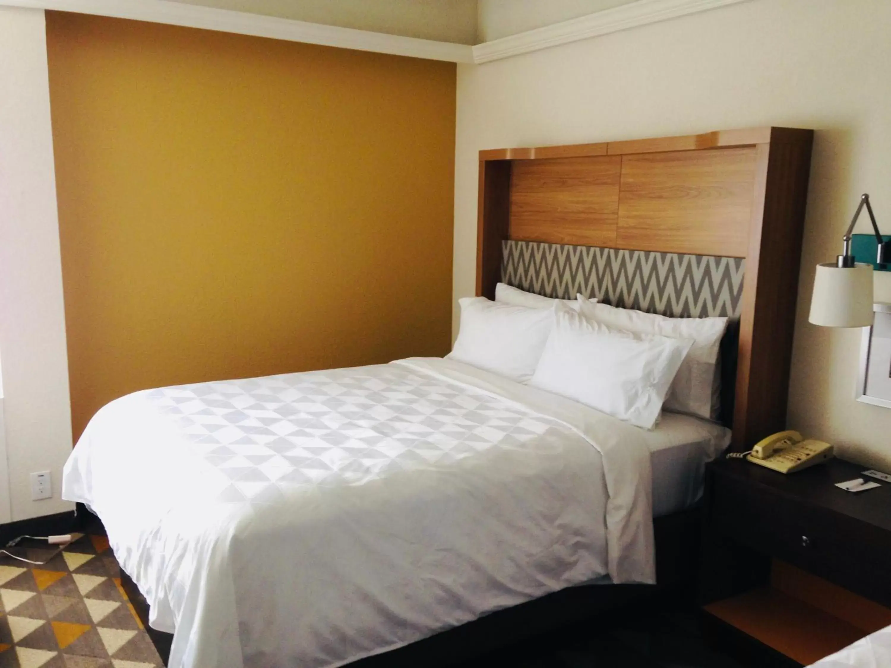 Bed in Holiday Inn & Suites Pittsfield-Berkshires, an IHG Hotel