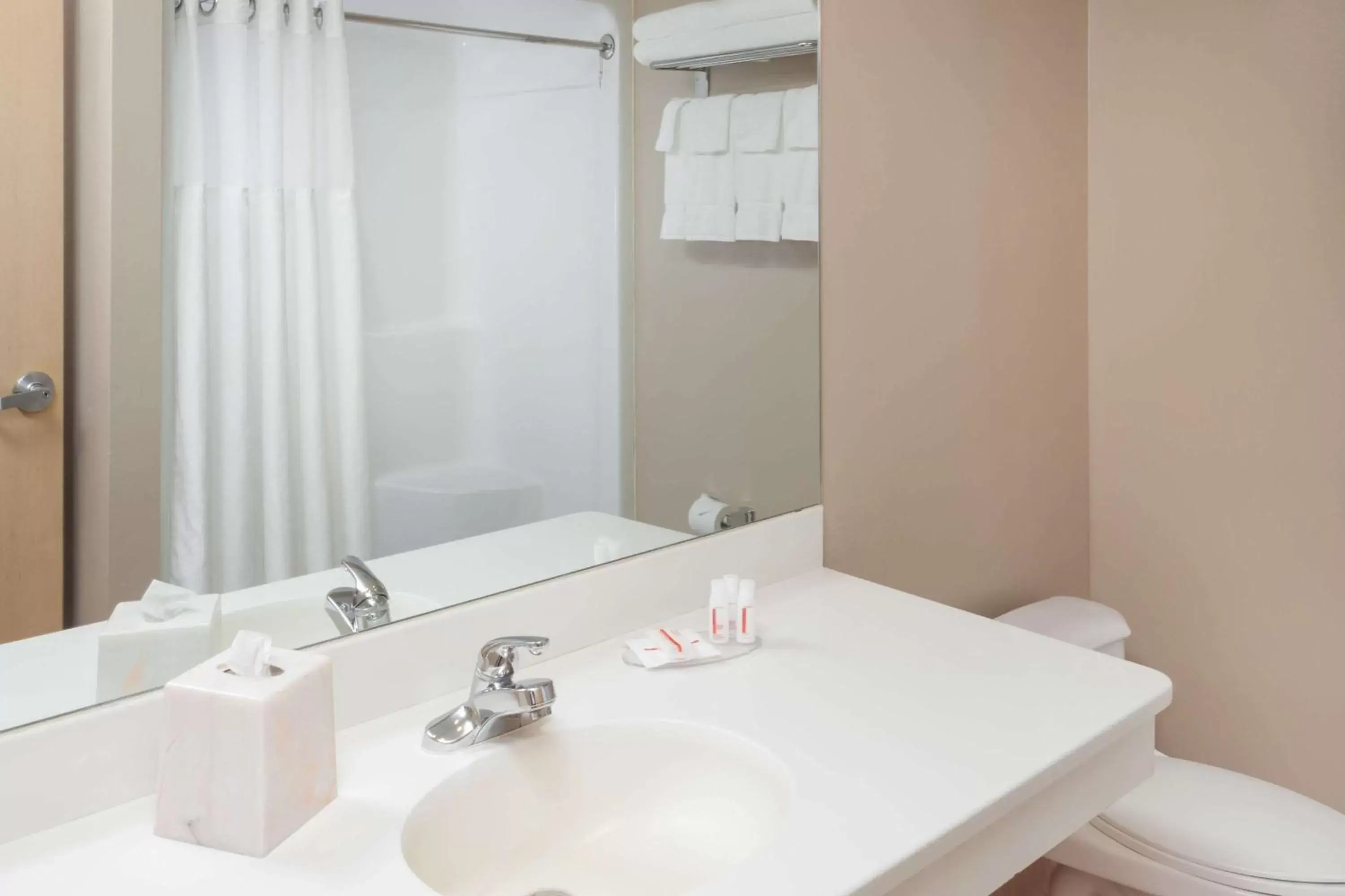 Bathroom in Ramada by Wyndham Hammond Hotel & Conference Center