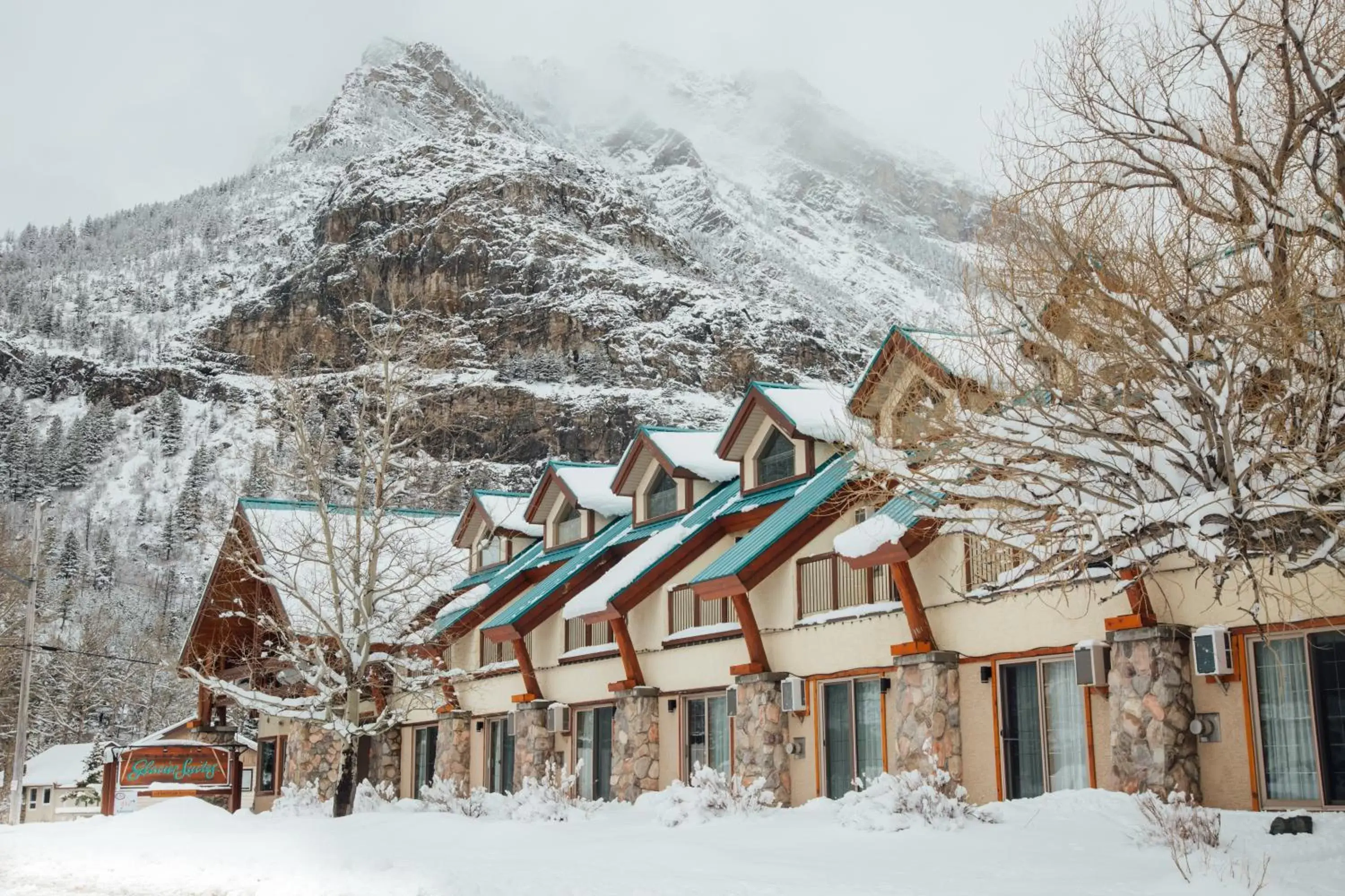 Property building, Winter in Waterton Glacier Suites