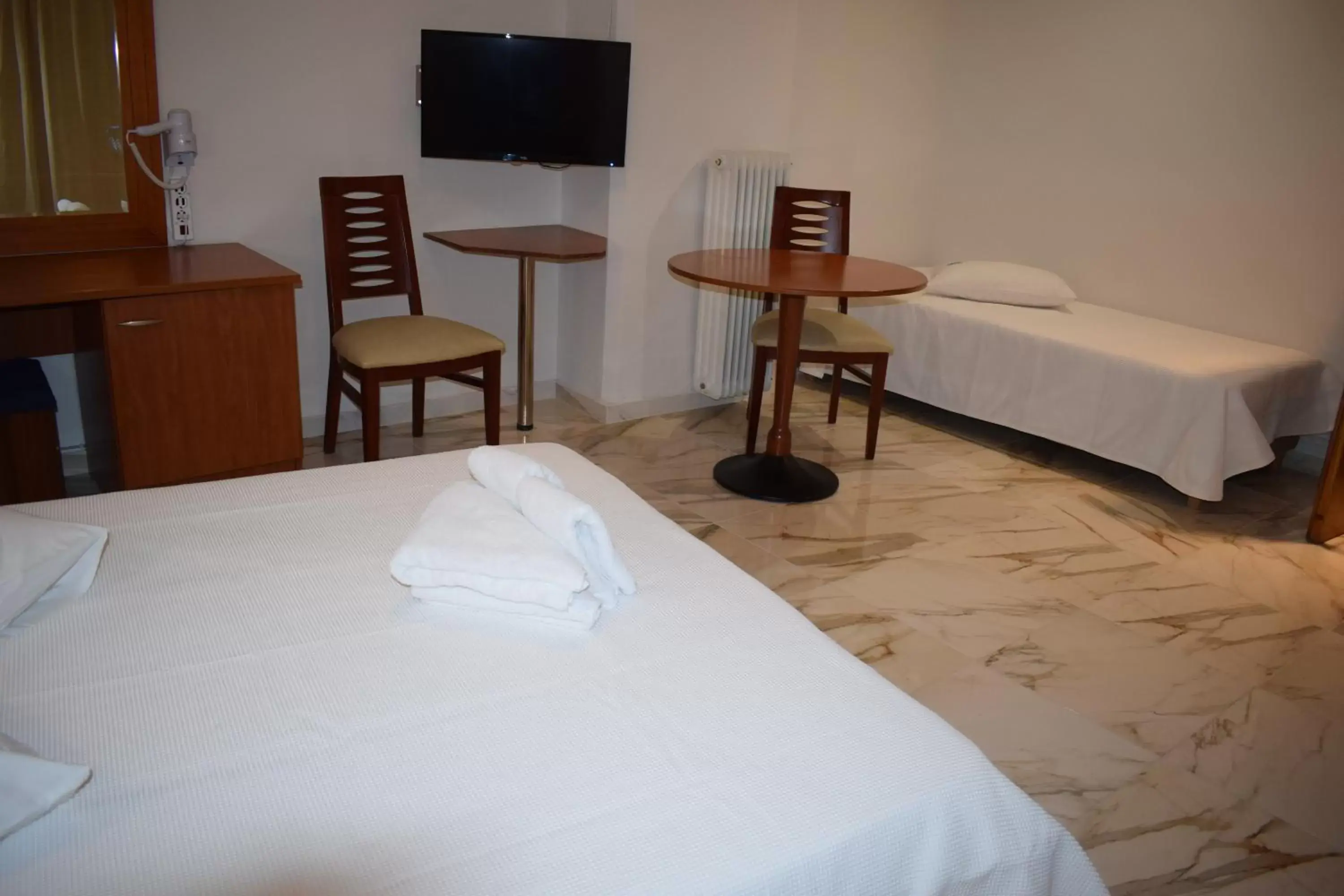 Bed in Piraeus Acropole Hotel