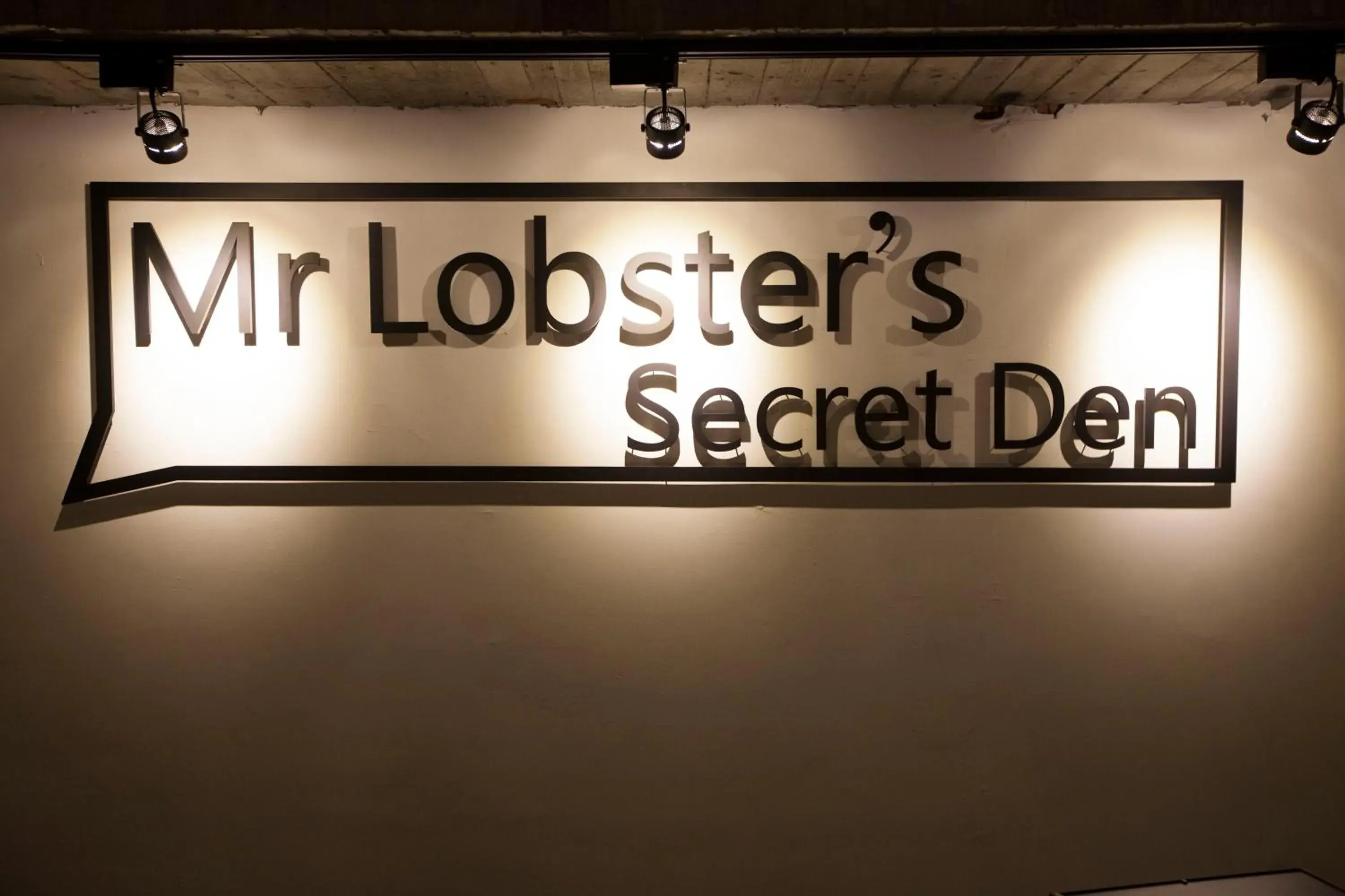 Property logo or sign in Mr Lobster's Secret Den Design Hostel