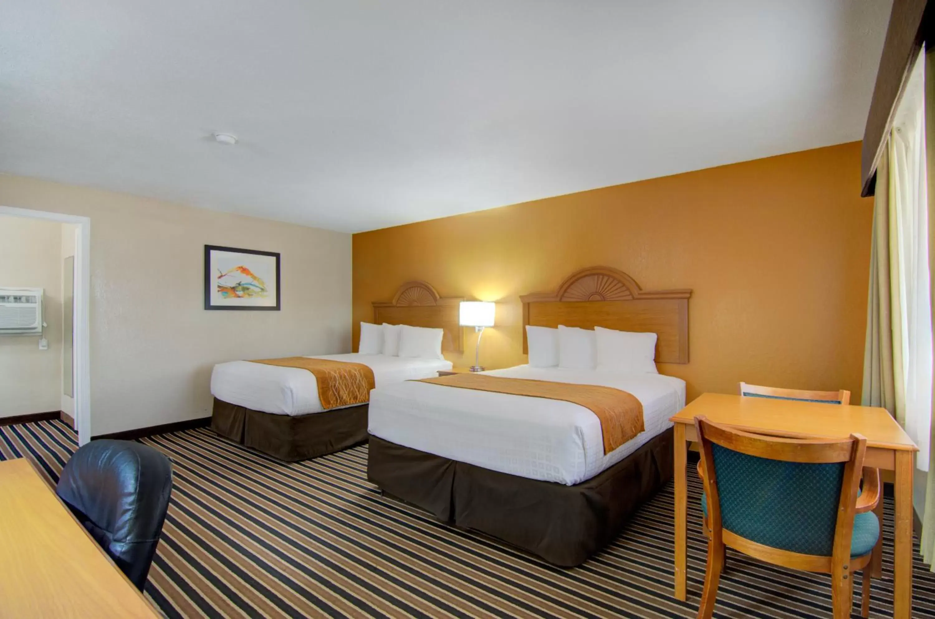 Bed in Westbridge Inn & Suites Bed in Westbridge Inn & Suites