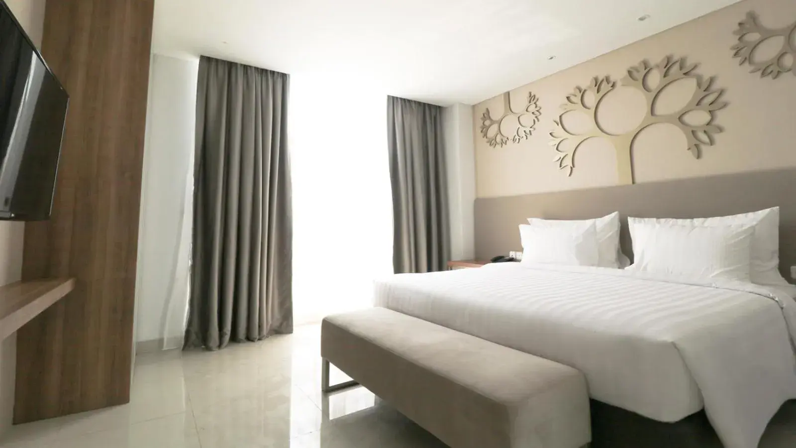 Bed in PALM PARK Hotel Surabaya