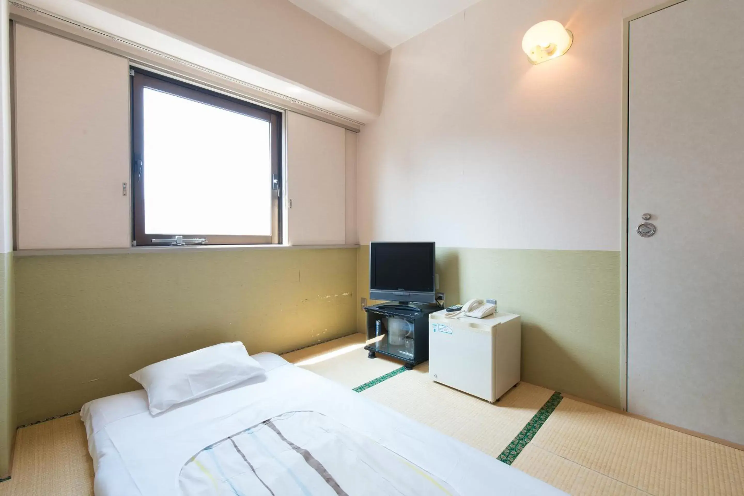 Photo of the whole room, Bed in Tabist Hotel Tetora Kitakyushu