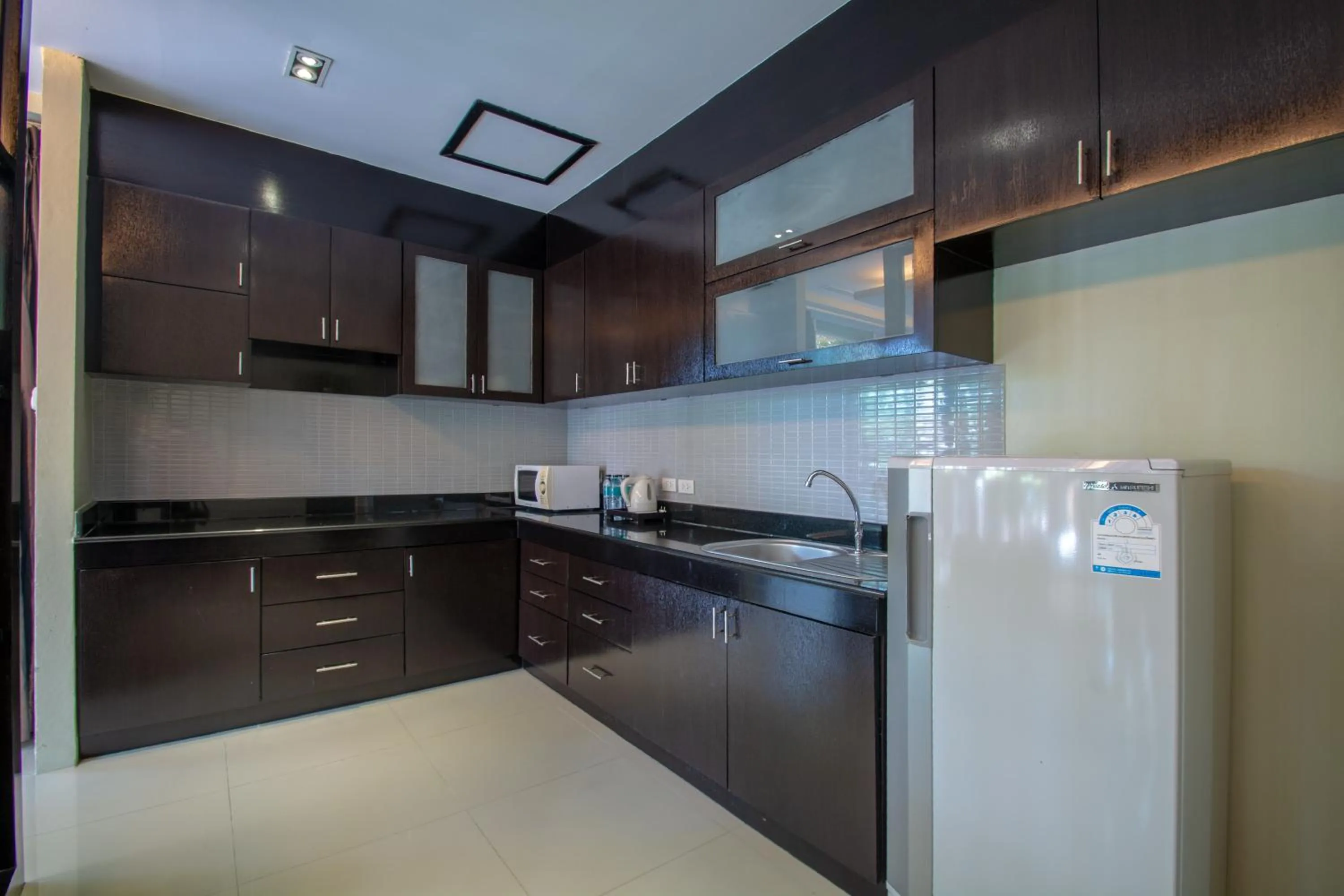 Kitchen or kitchenette in Peach Blossom Resort & Pool Villa - SHA Plus