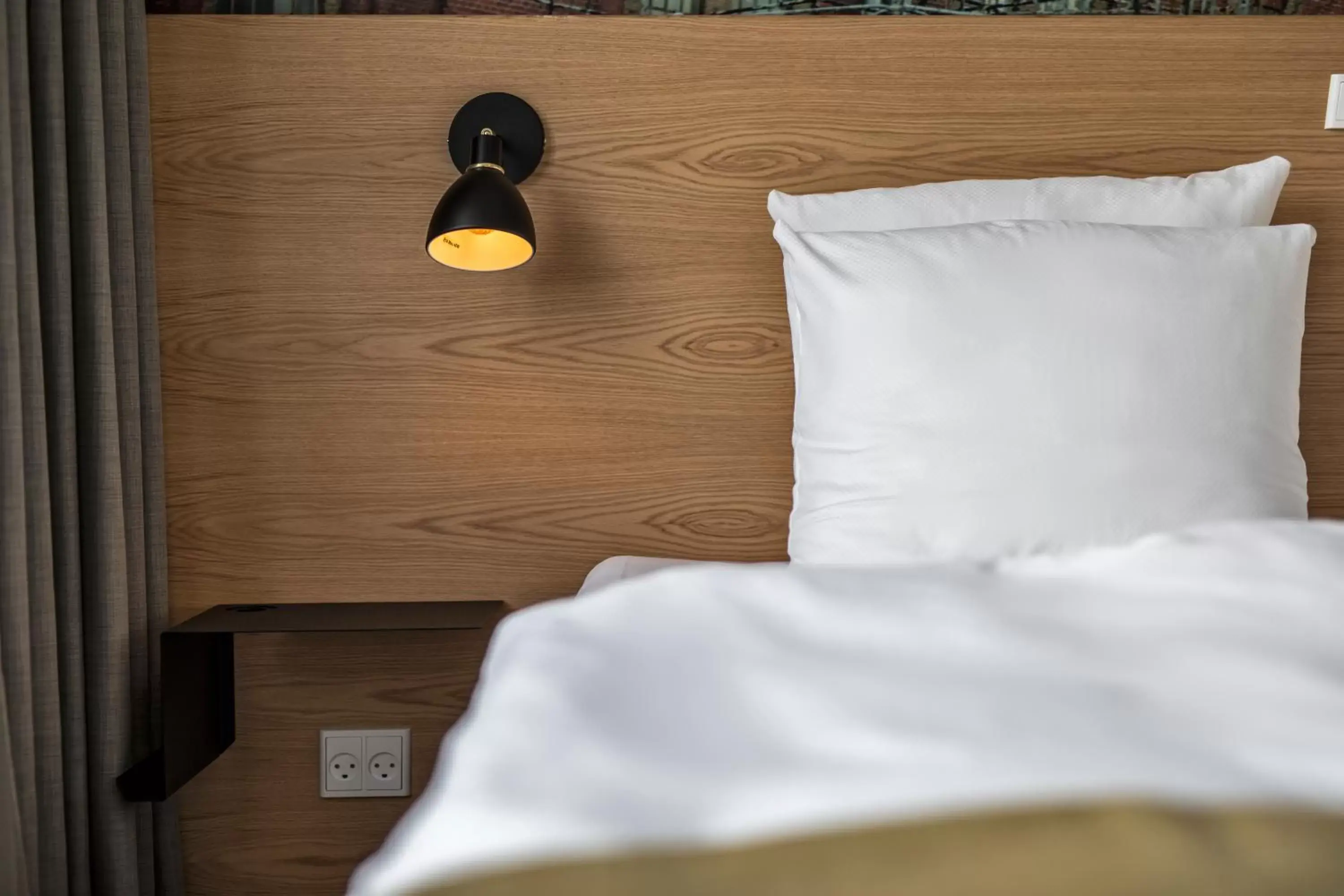 Bed in KOMPAS Hotel Aalborg Bed in KOMPAS Hotel Aalborg