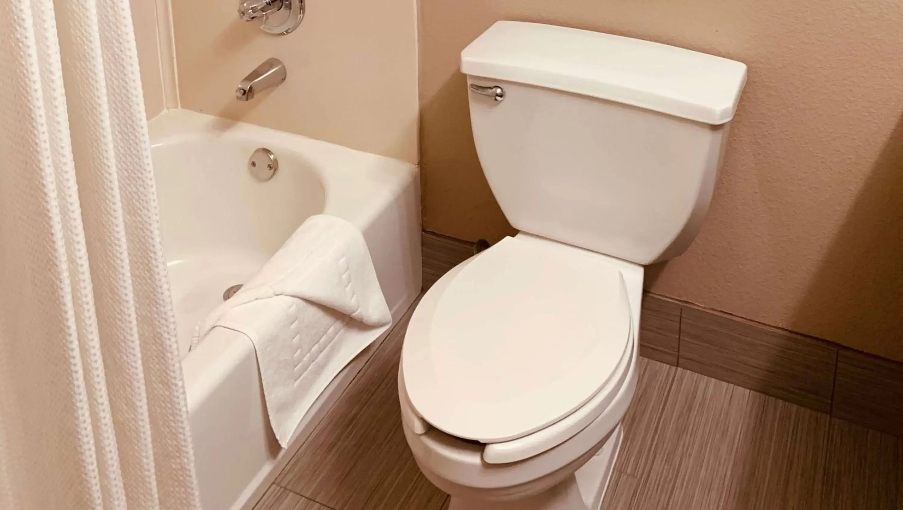 Bathroom in SureStay Plus Hotel by Best Western Plano