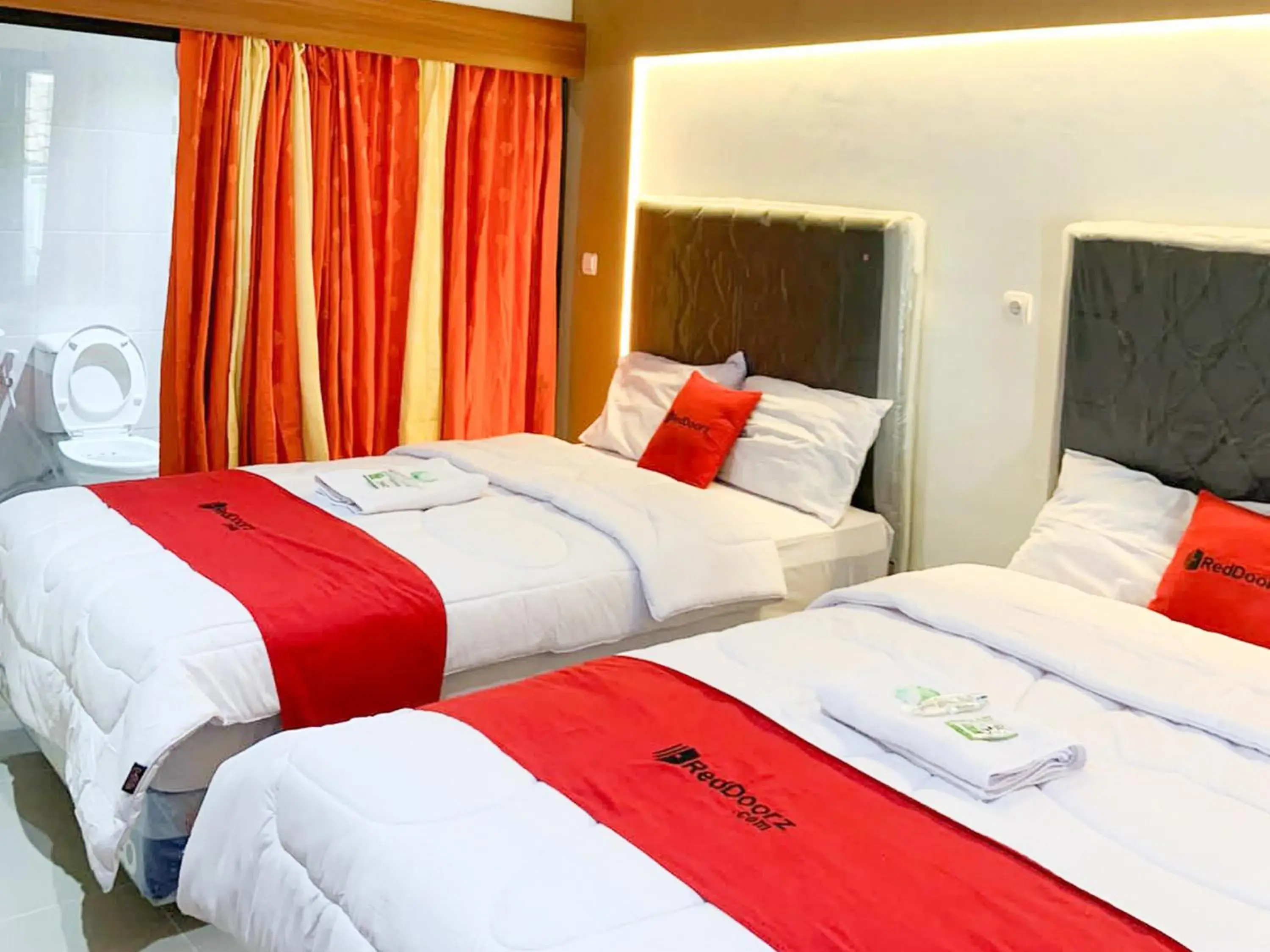 Bed in RedDoorz near Museum Gunung Merapi