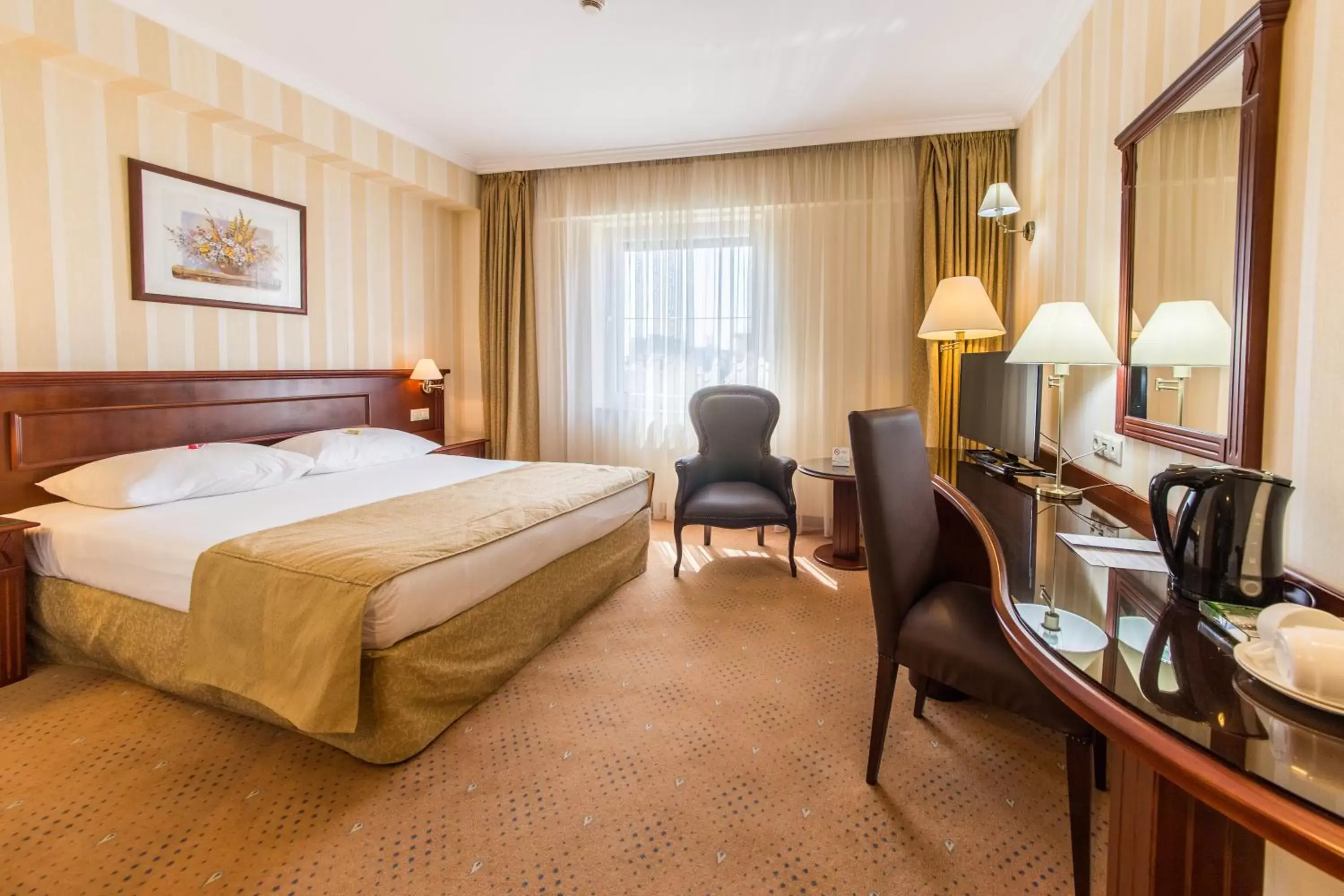 Bed in Ramada Hotel & Suites by Wyndham Bucharest North