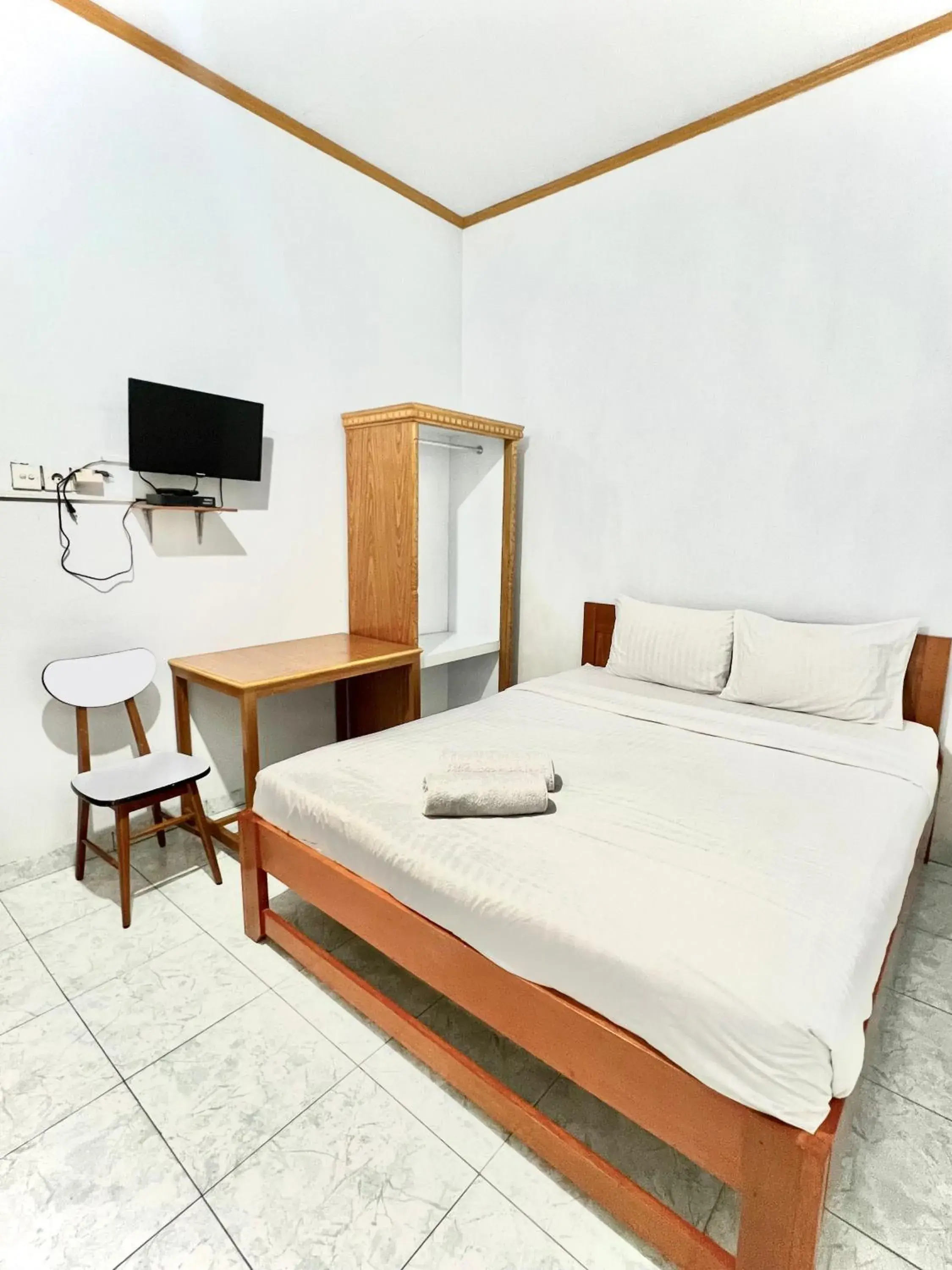 Bed in Wisma Mutiara Hotel