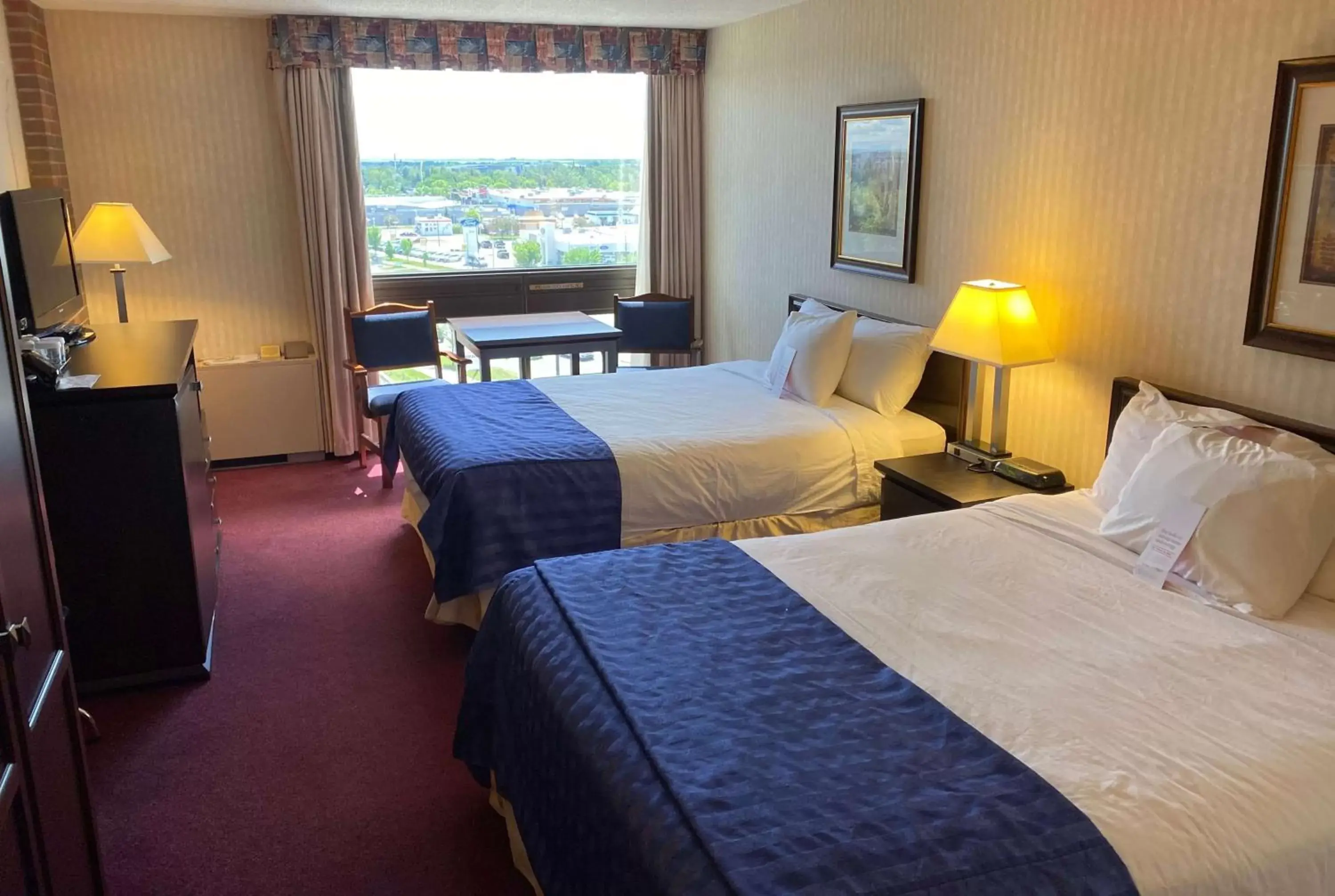 Photo of the whole room, Bed in Ramada by Wyndham Lethbridge
