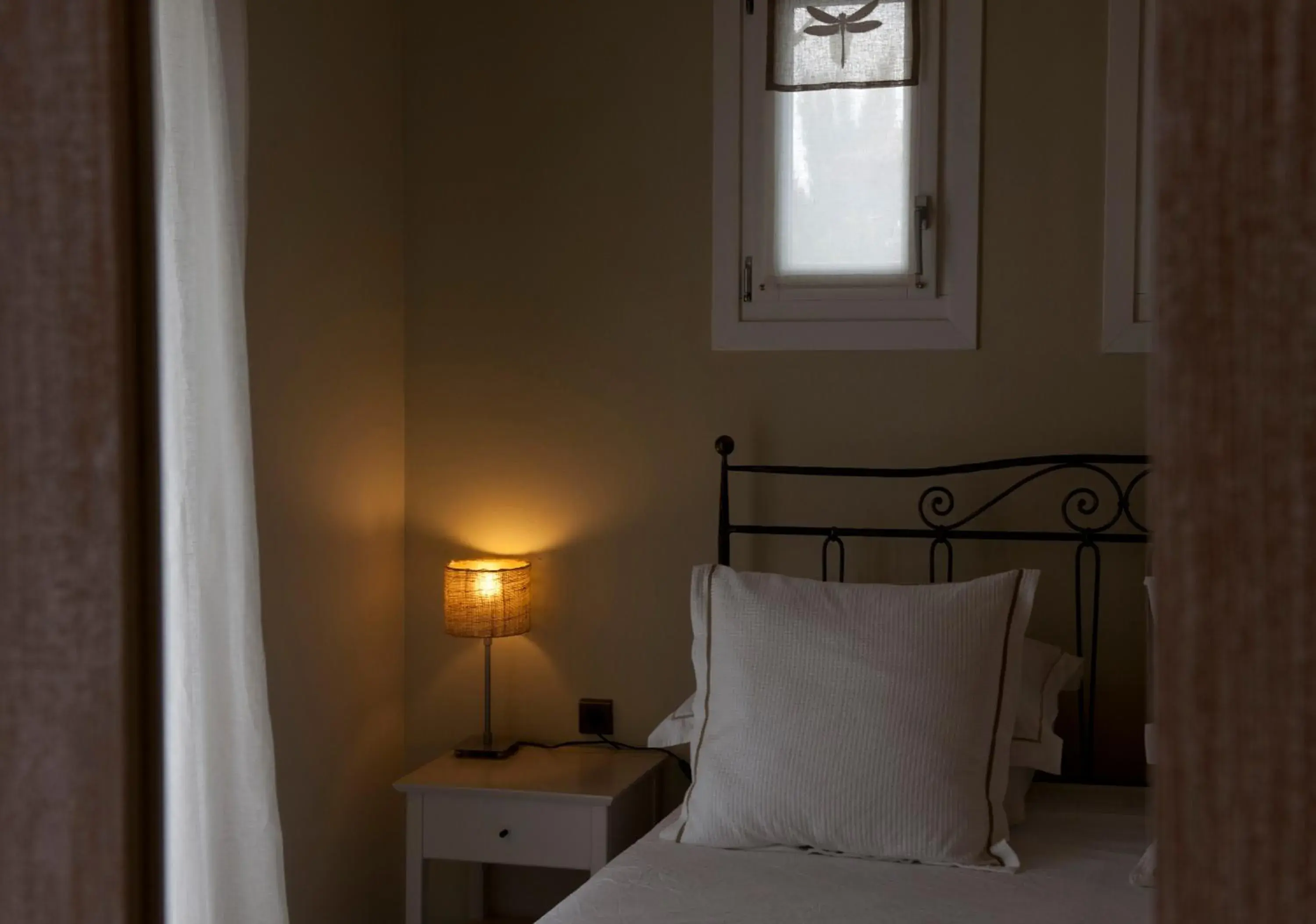 Decorative detail, Bed in Ammos Naxos Exclusive Apartment