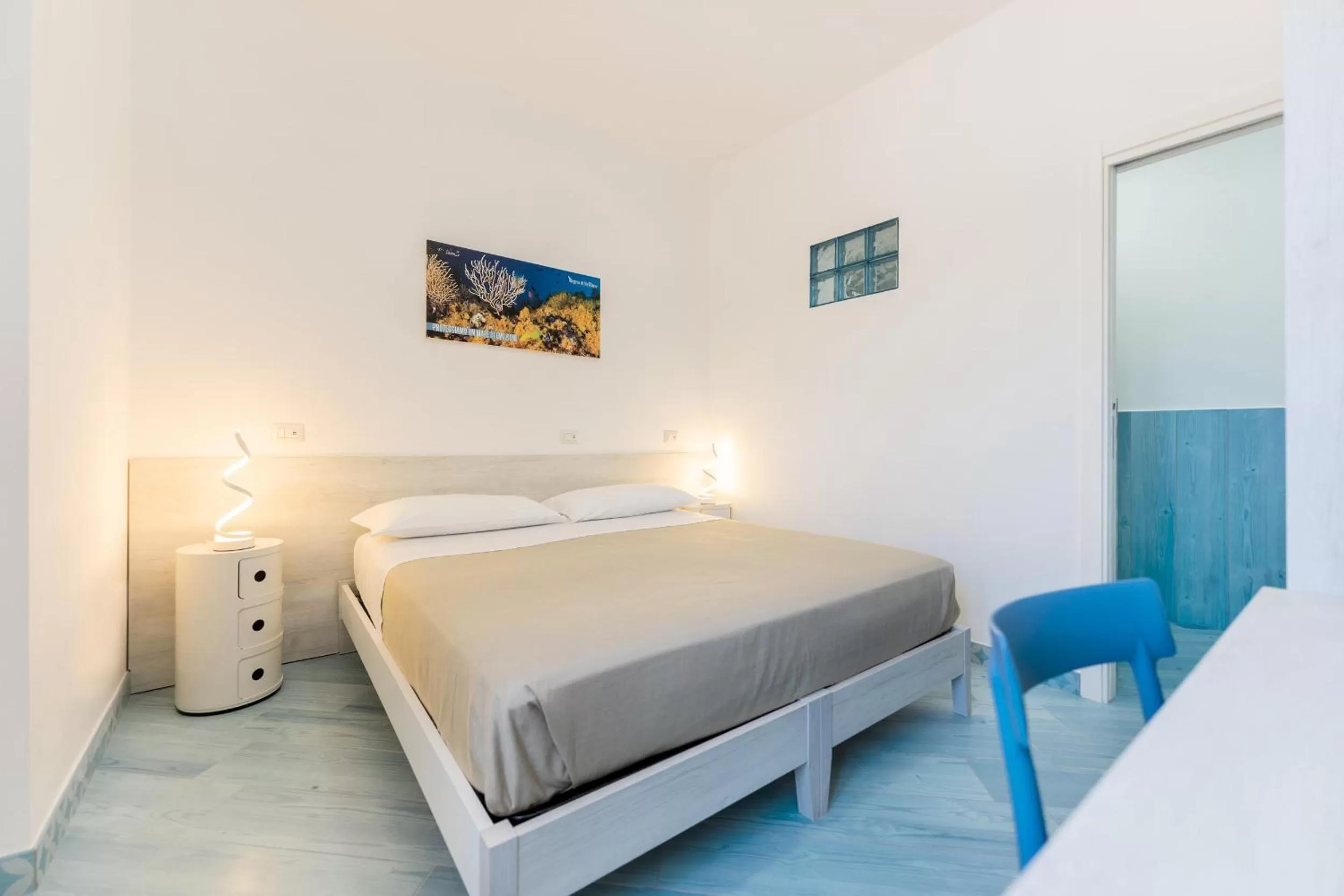 Bed in Poseidonia Rooms