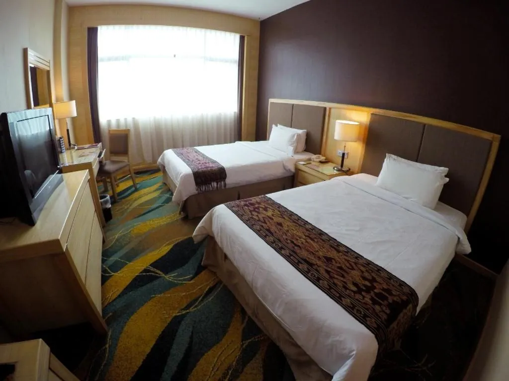 Bed in Imperial Palace Hotel