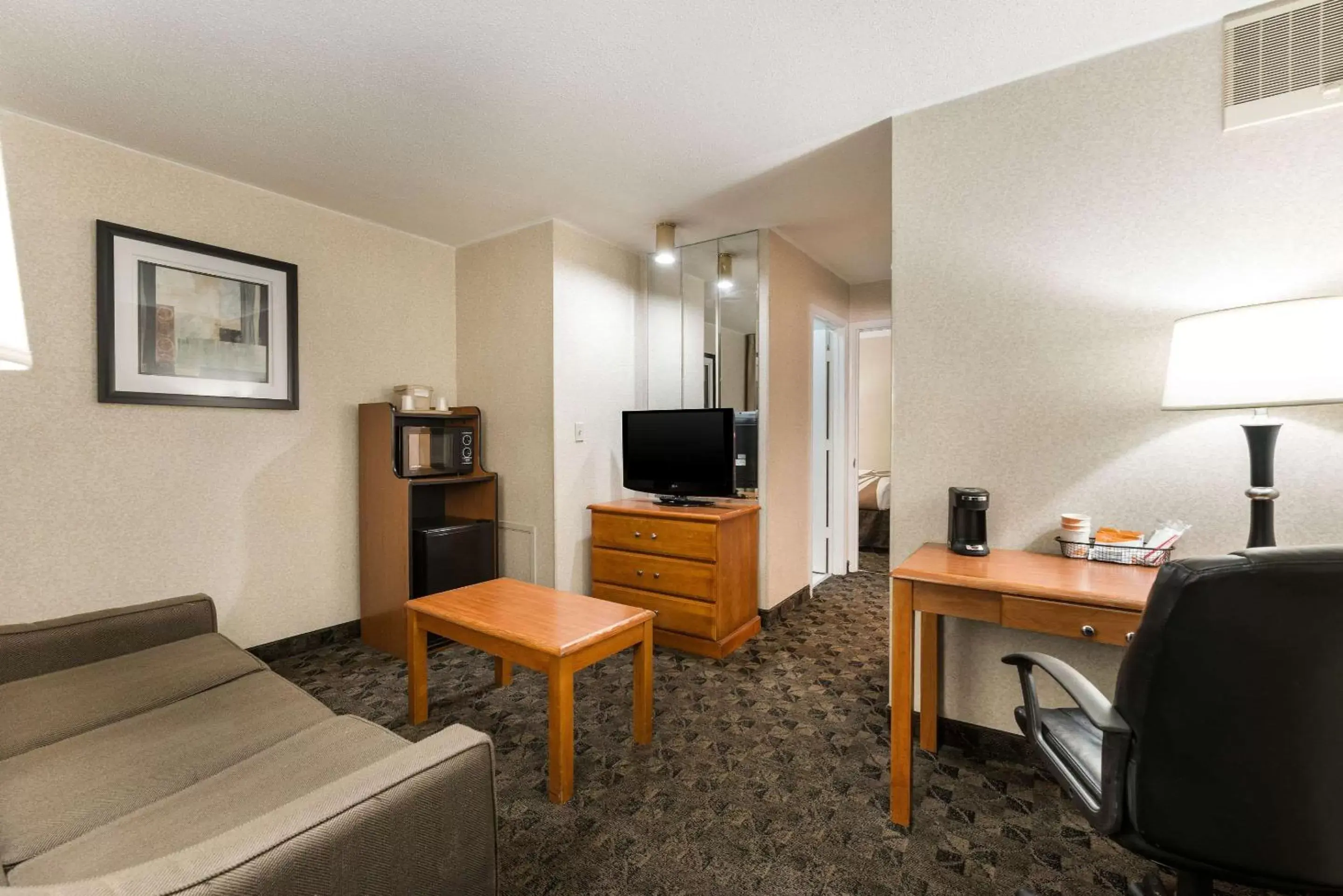 Photo of the whole room, TV/Entertainment Center in Quality Inn & Suites