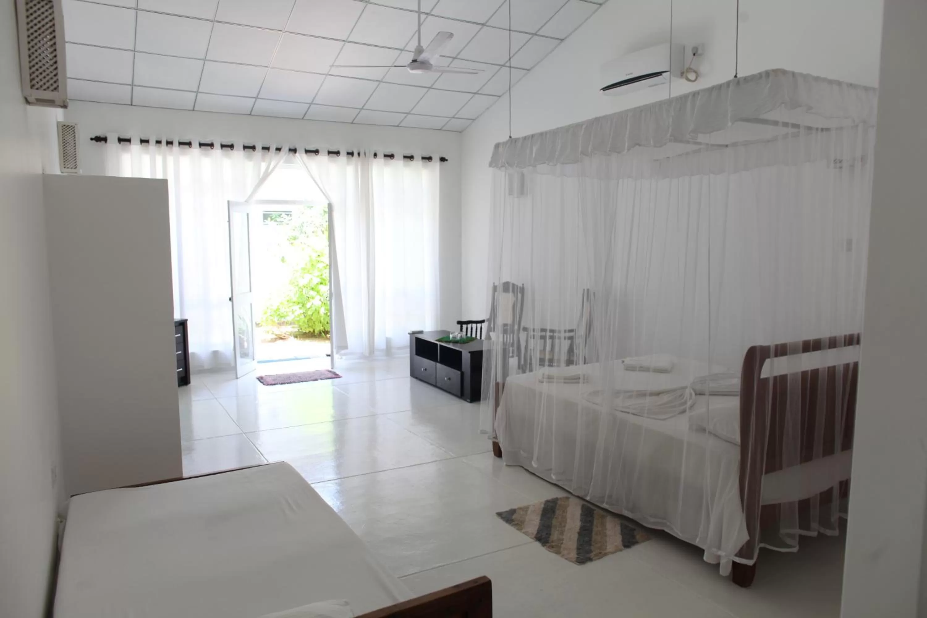 Photo of the whole room, Bed in Chitra Ayurveda