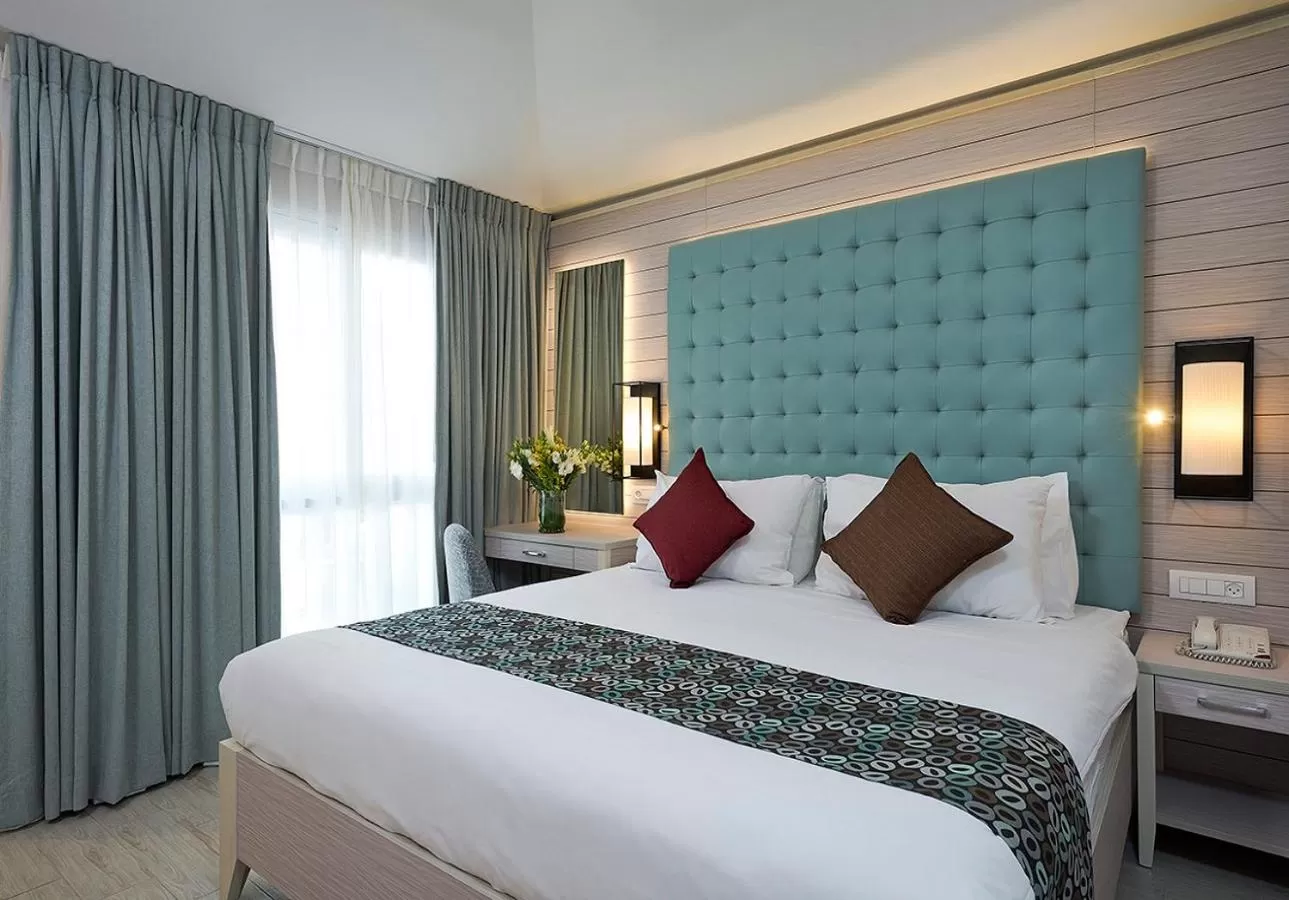 Bed in Astral Village Hotel