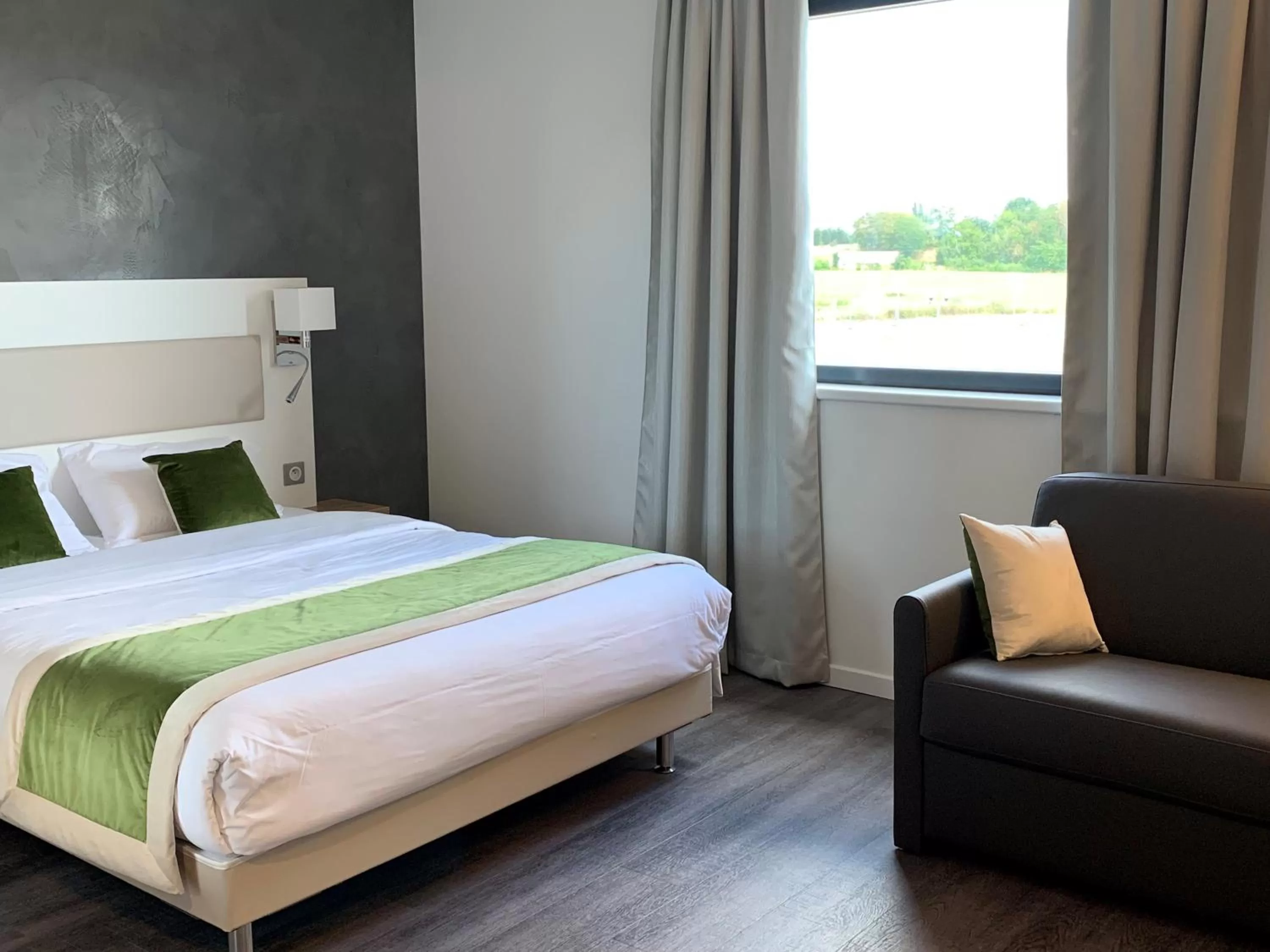 Bed in ATOLON PARK HOTEL