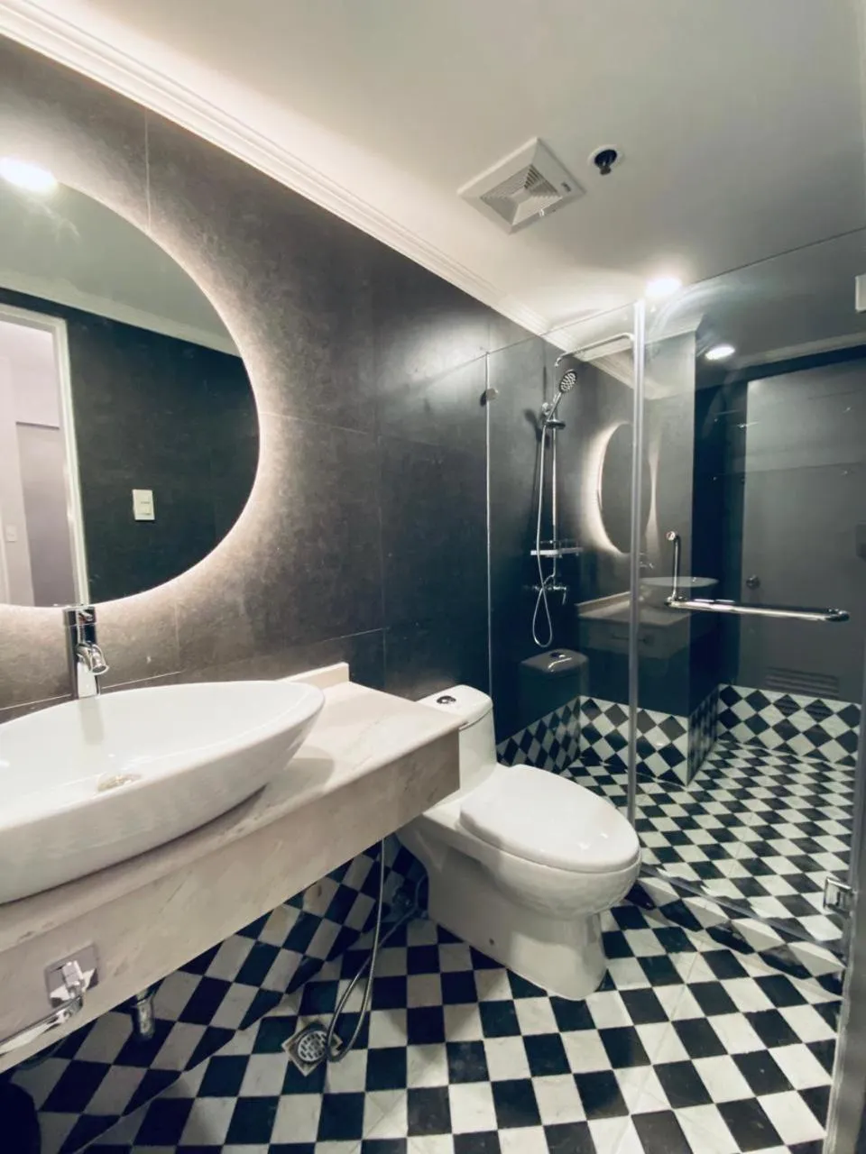 Toilet, Bathroom in Mpt Suites