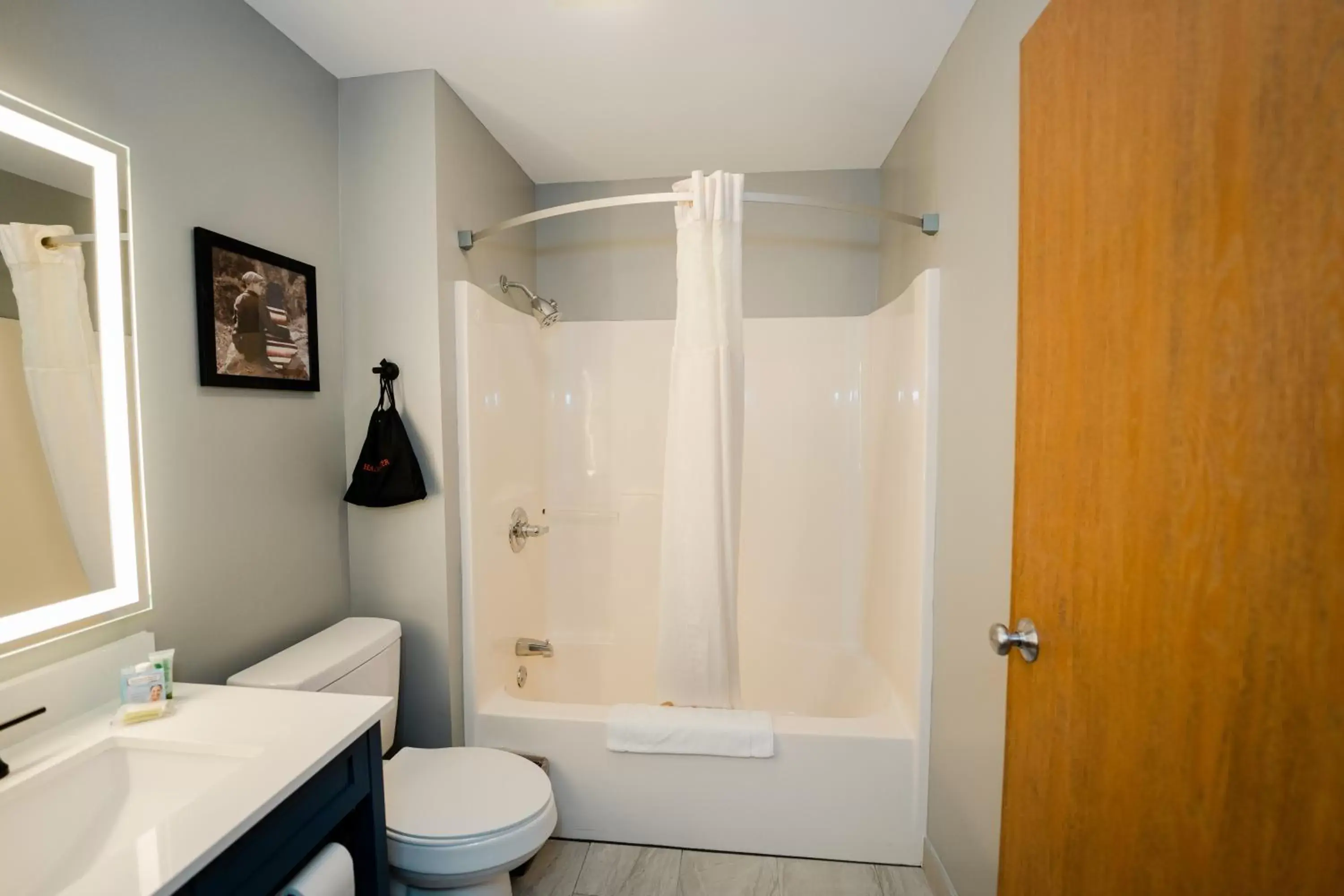 Bathroom in AmericInn by Wyndham Tomahawk