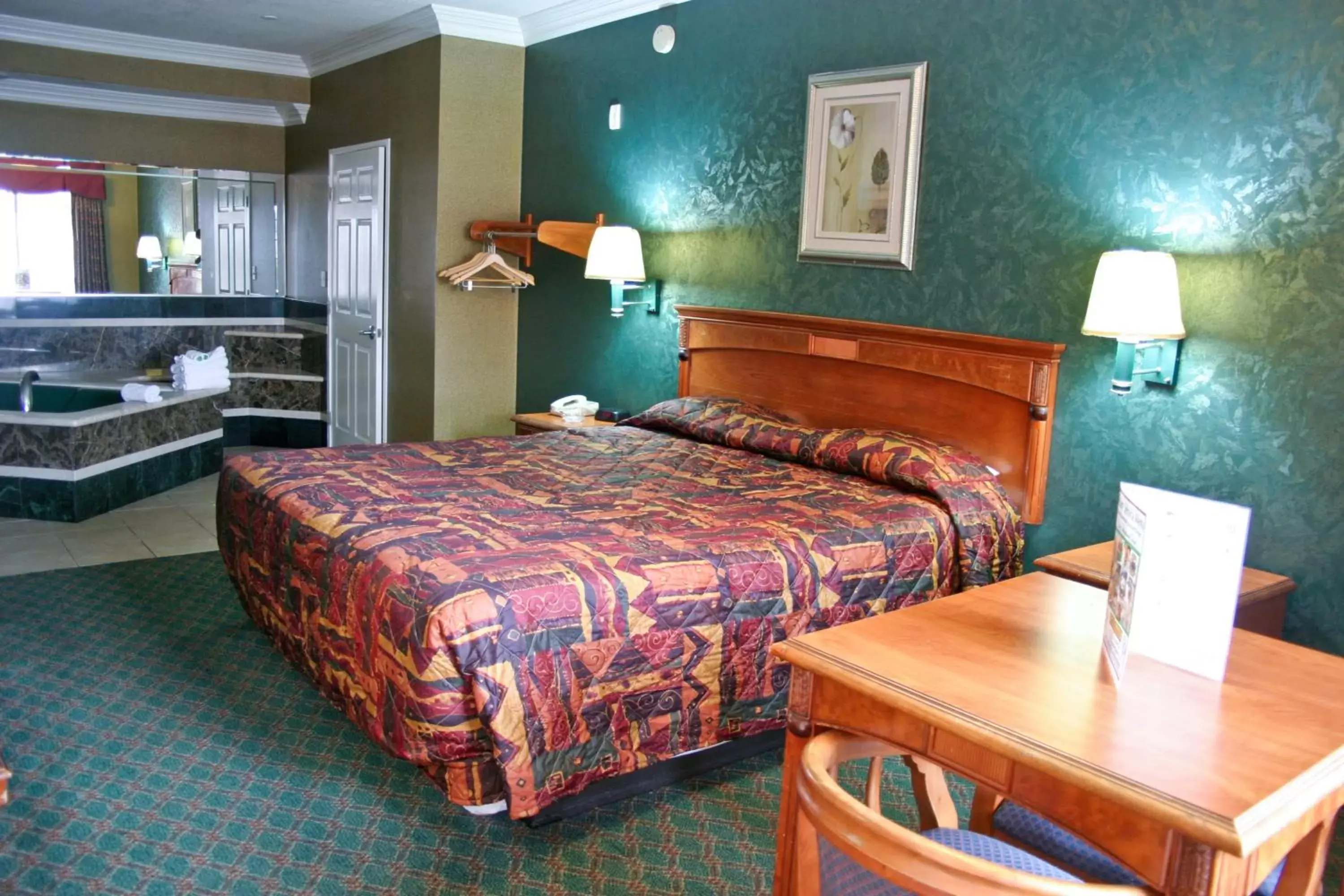 Bed in Crystal Inn Suites & Spas