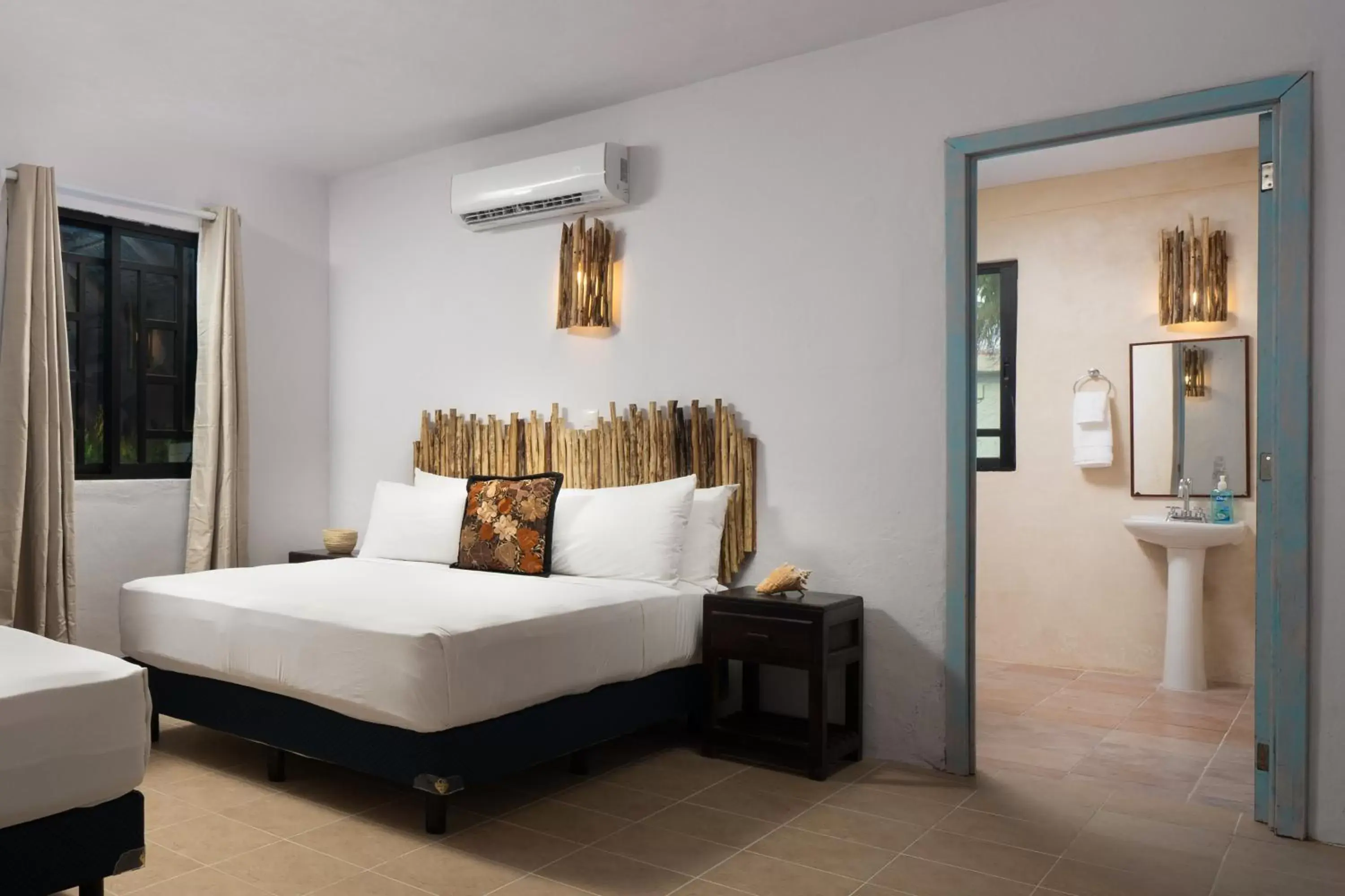 Bed, Seating Area in La Diosa Tulum Resort & SPA