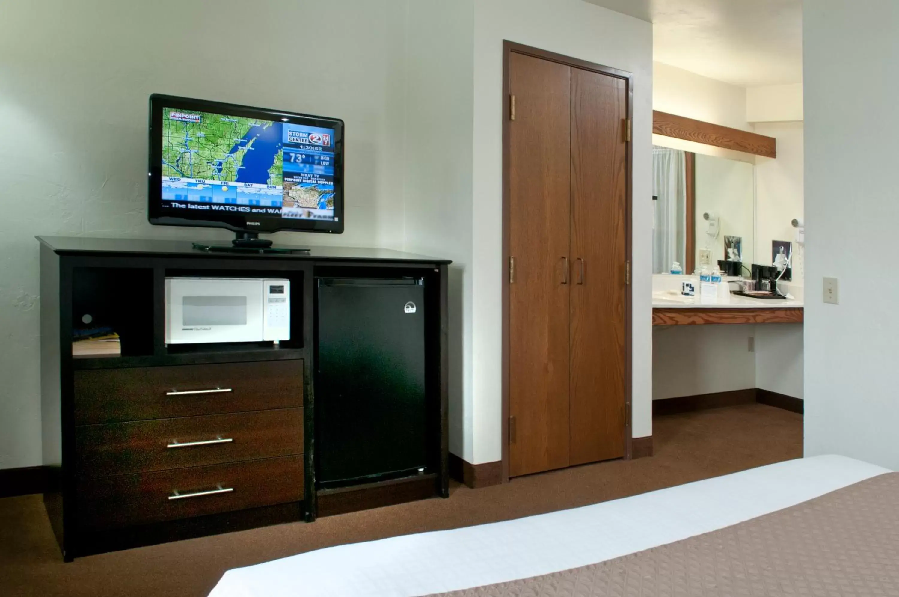 Decorative detail, Bed in AmericInn by Wyndham Green Bay West Decorative detail, Bed in AmericInn by Wyndham Green Bay West