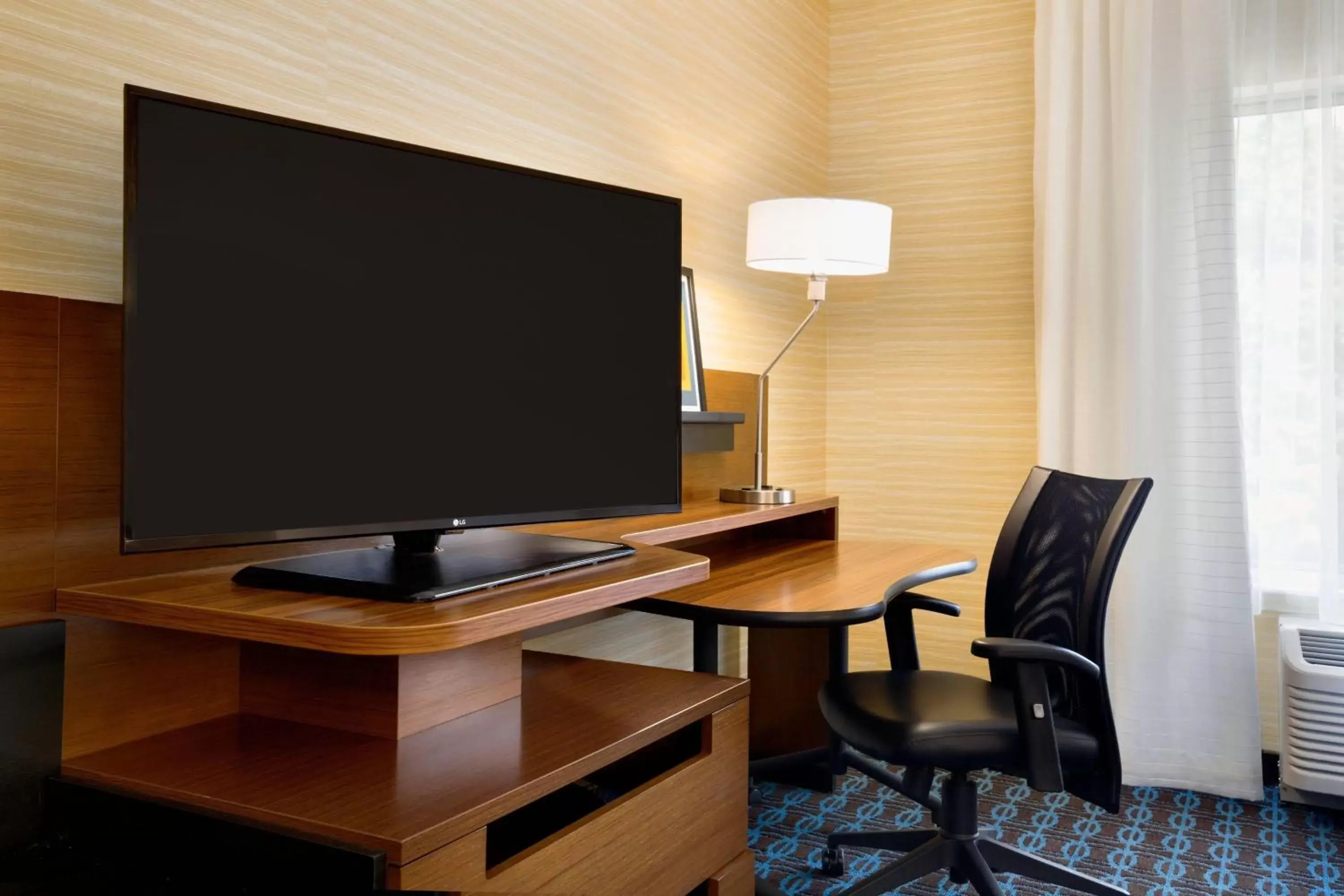 Photo of the whole room, TV/Entertainment Center in Fairfield Inn & Suites by Marriott Lancaster East at The Outlets