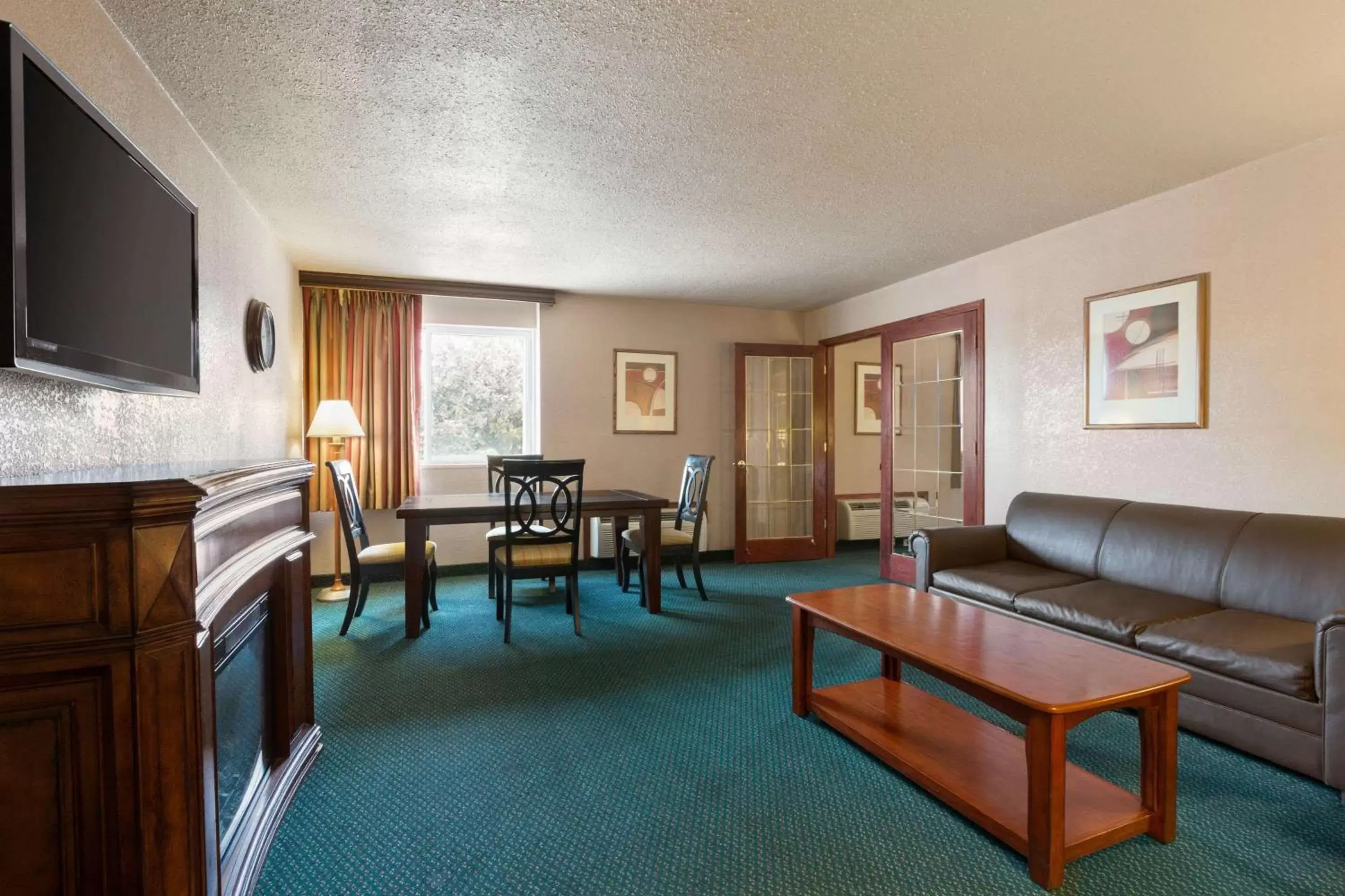 Photo of the whole room, Seating Area in Ramada by Wyndham Bismarck