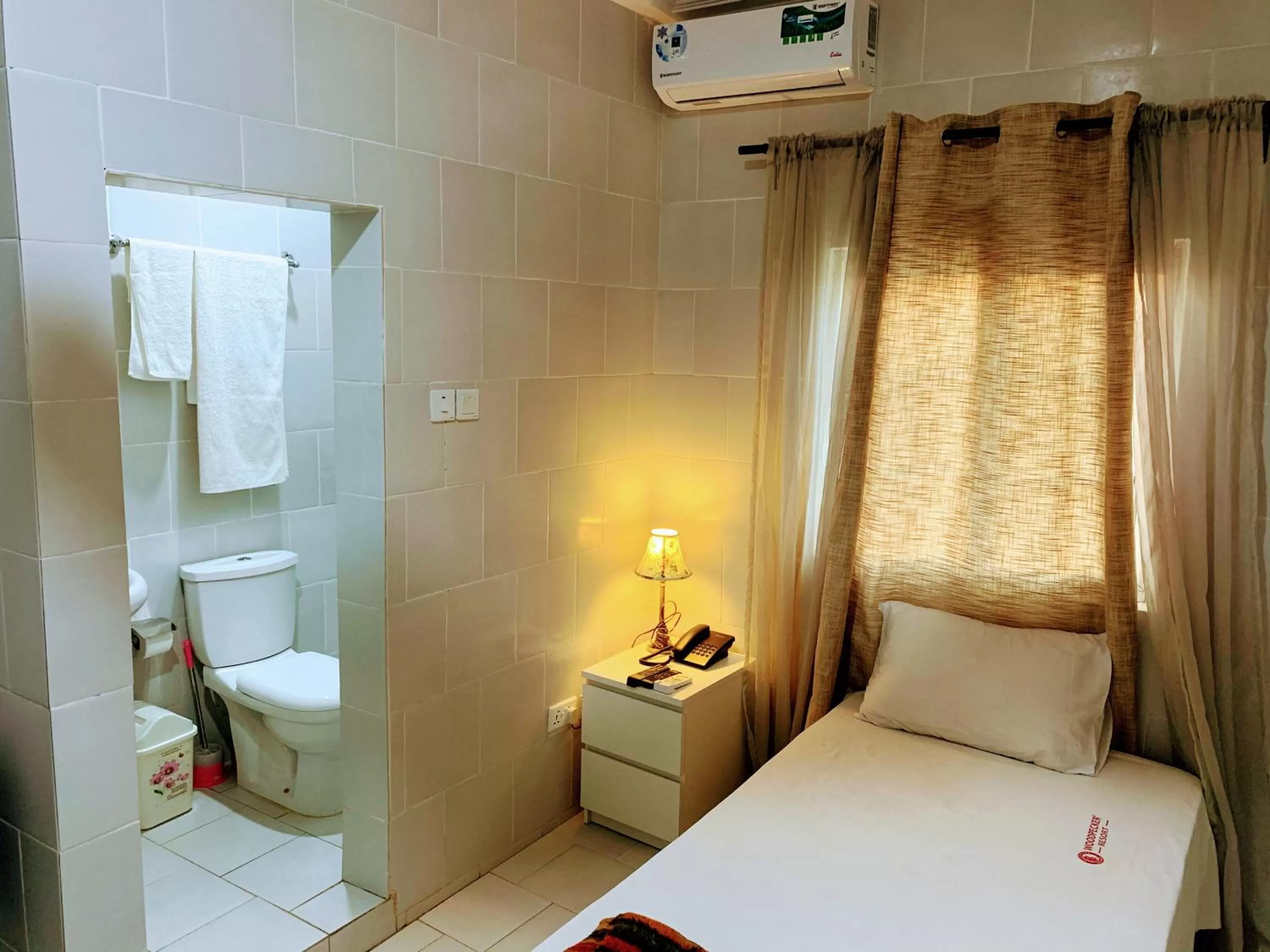 Shower, Bed in Woodpecker Resort Hotel