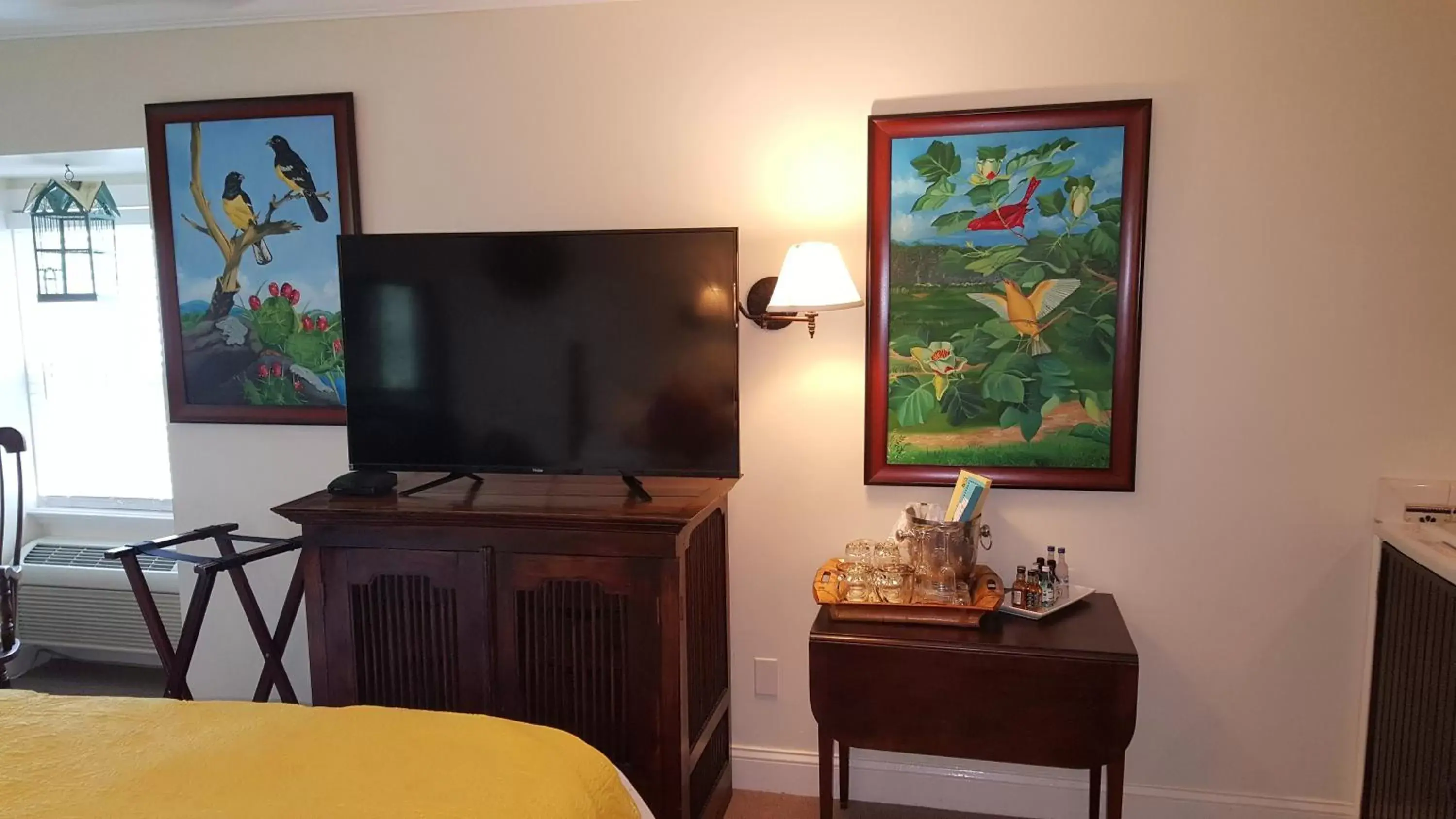 Photo of the whole room, TV/Entertainment Center in The Caribbean Court Boutique Hotel