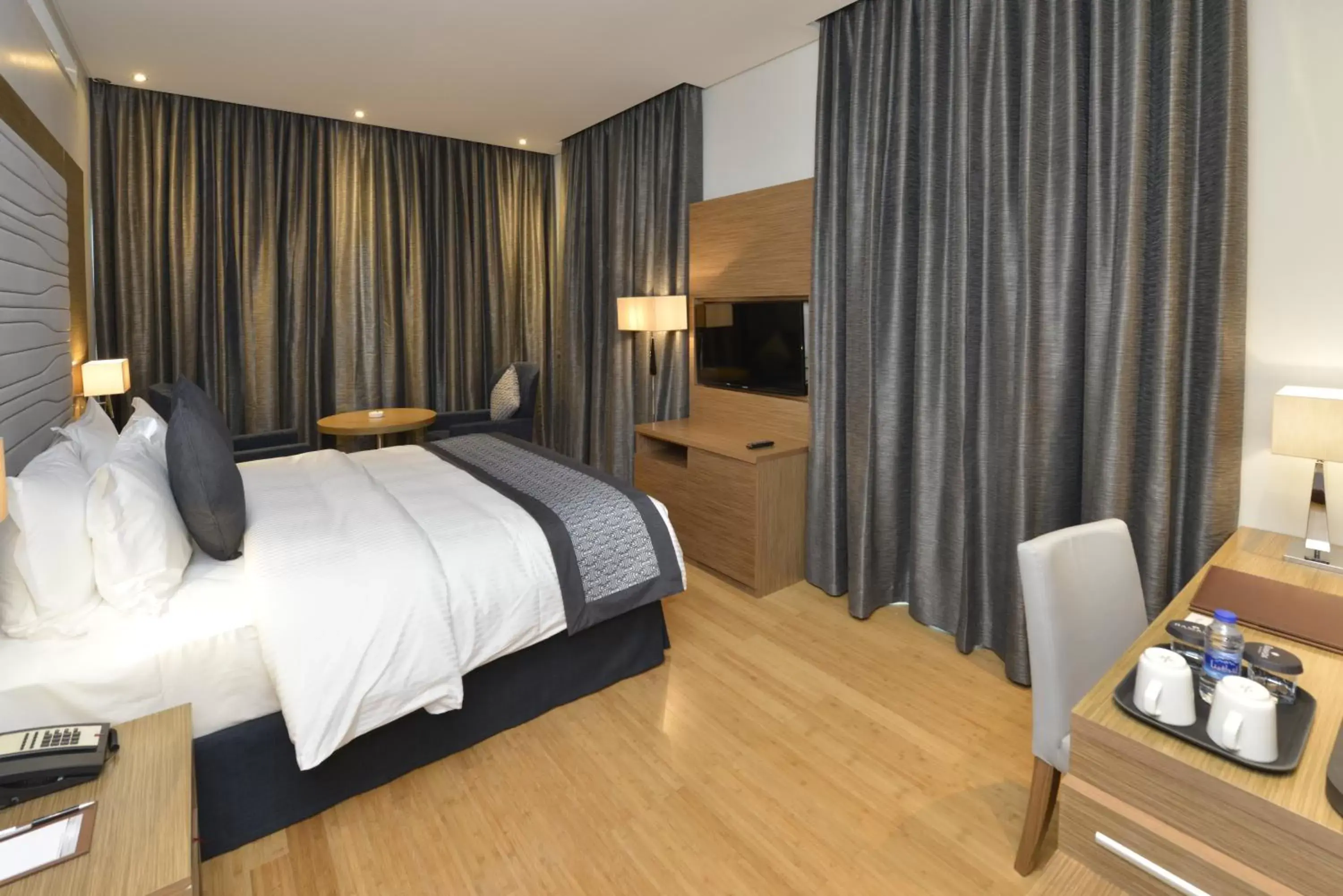 Shower, Bed in Ramada by Wyndham Manama City Centre