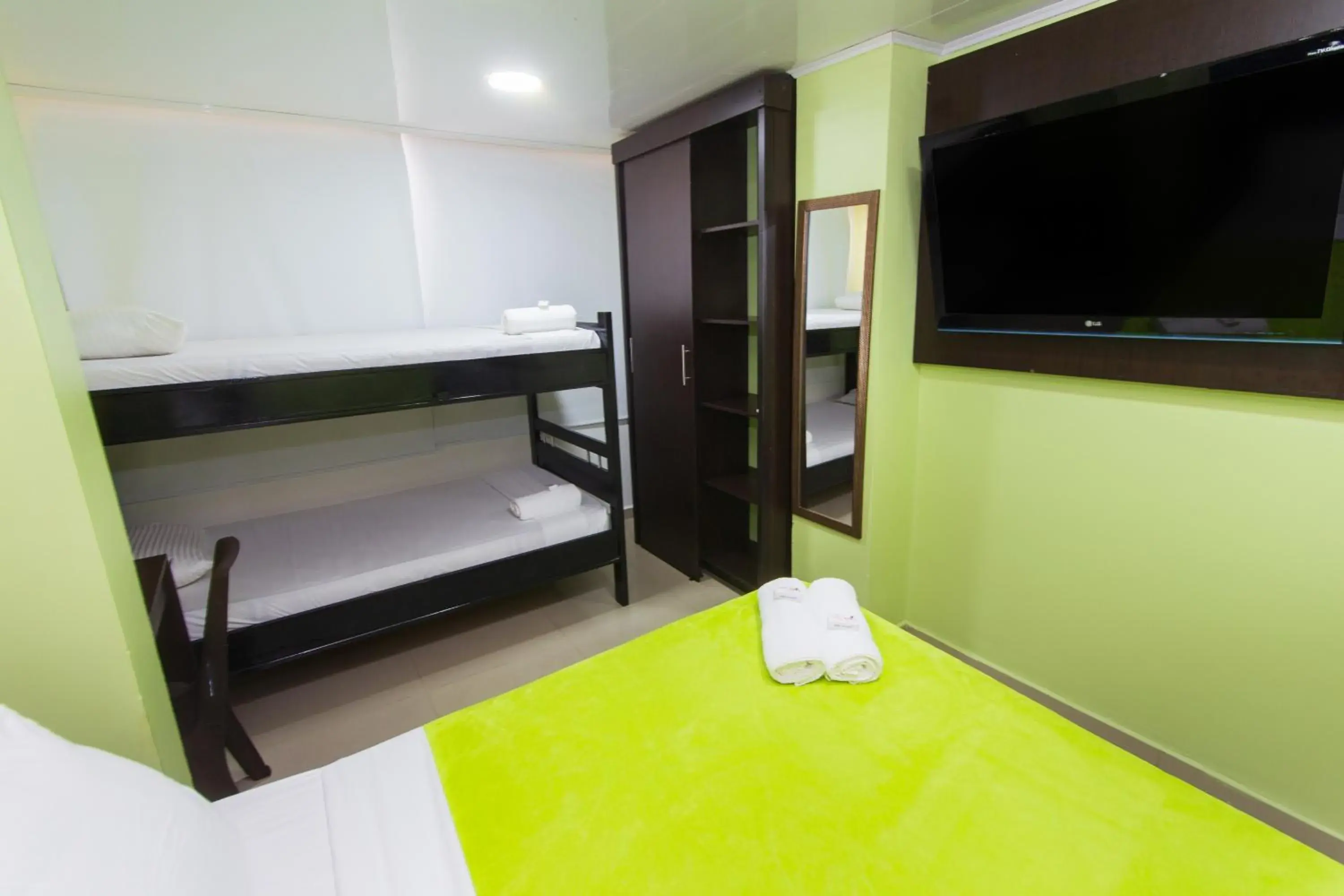 TV and multimedia, TV/Entertainment Center in Hotel Marina Suites By GEH Suites